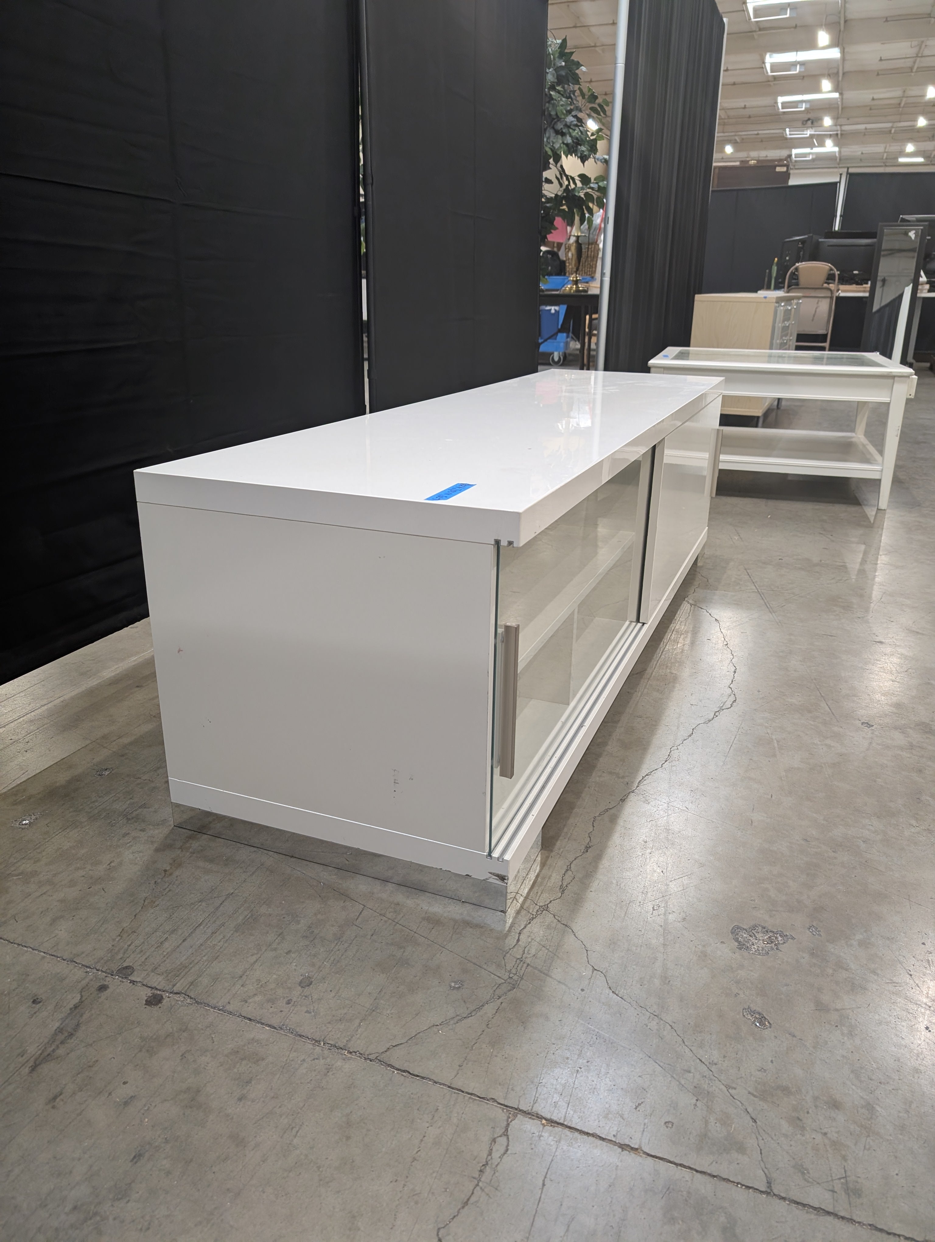 Sleek White Entertainment Unit with Sliding Doors