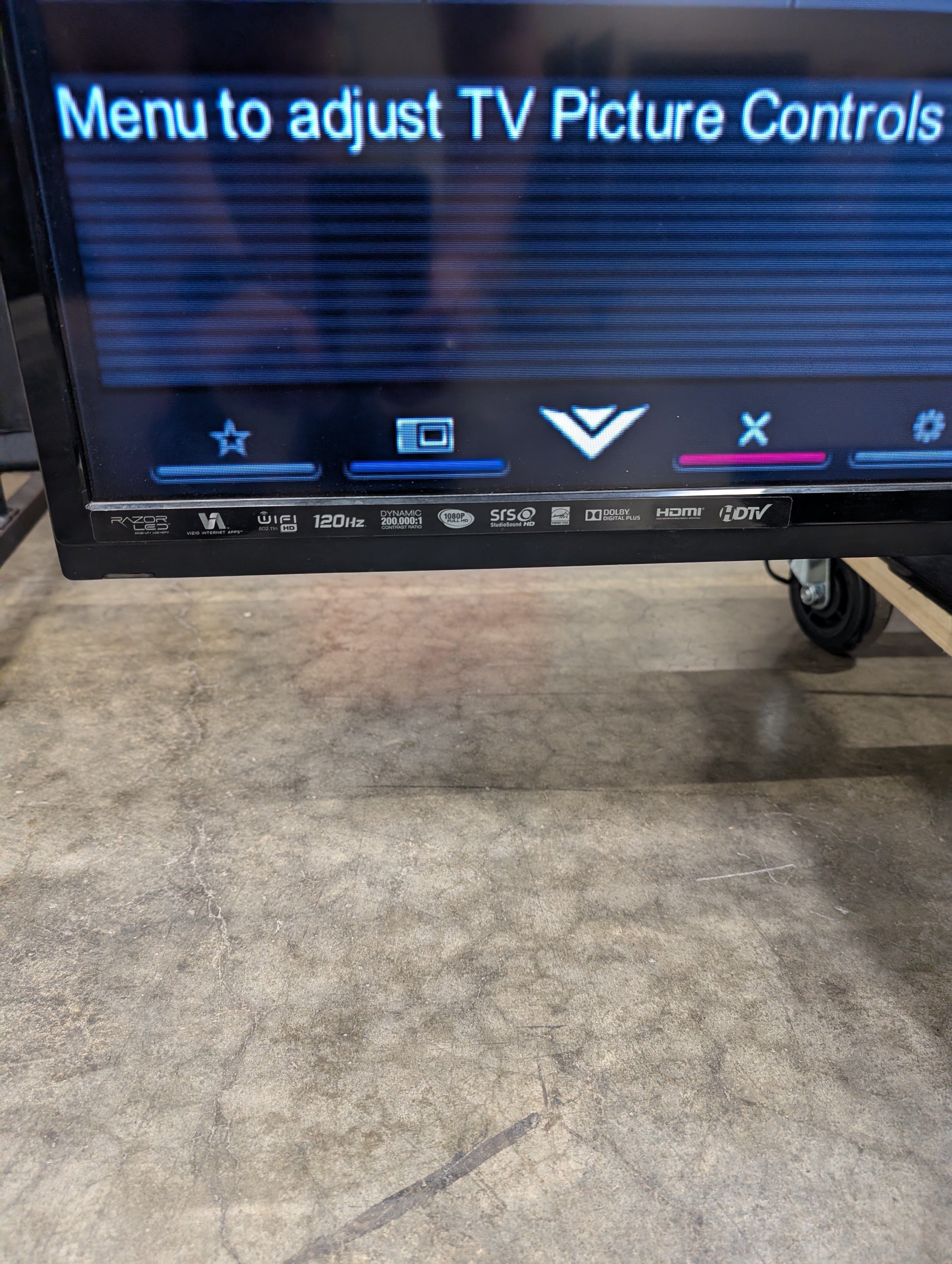 Black Flat Panel TV with Stand