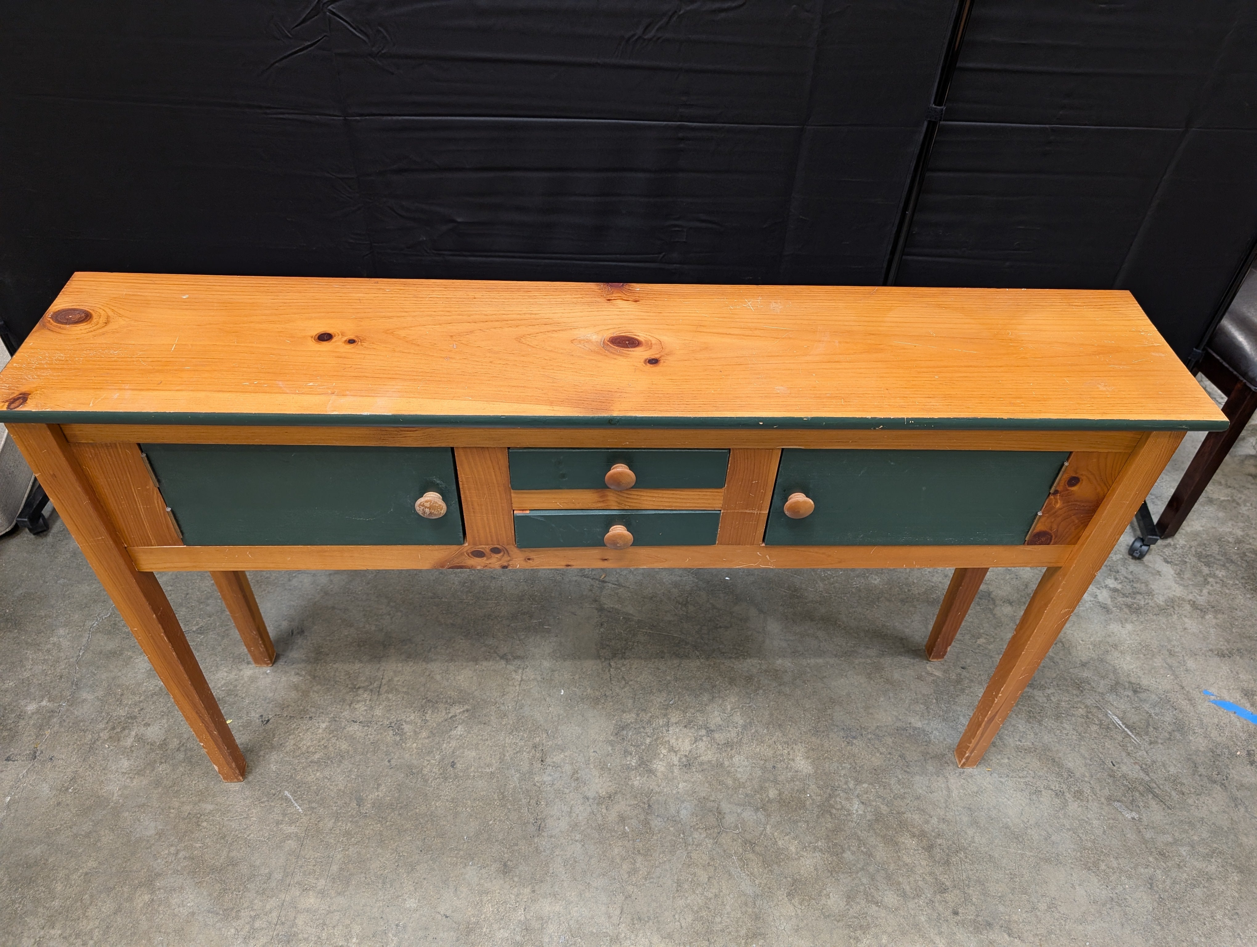 Rustic Wood Console Table with Dark Green Cabinetry
