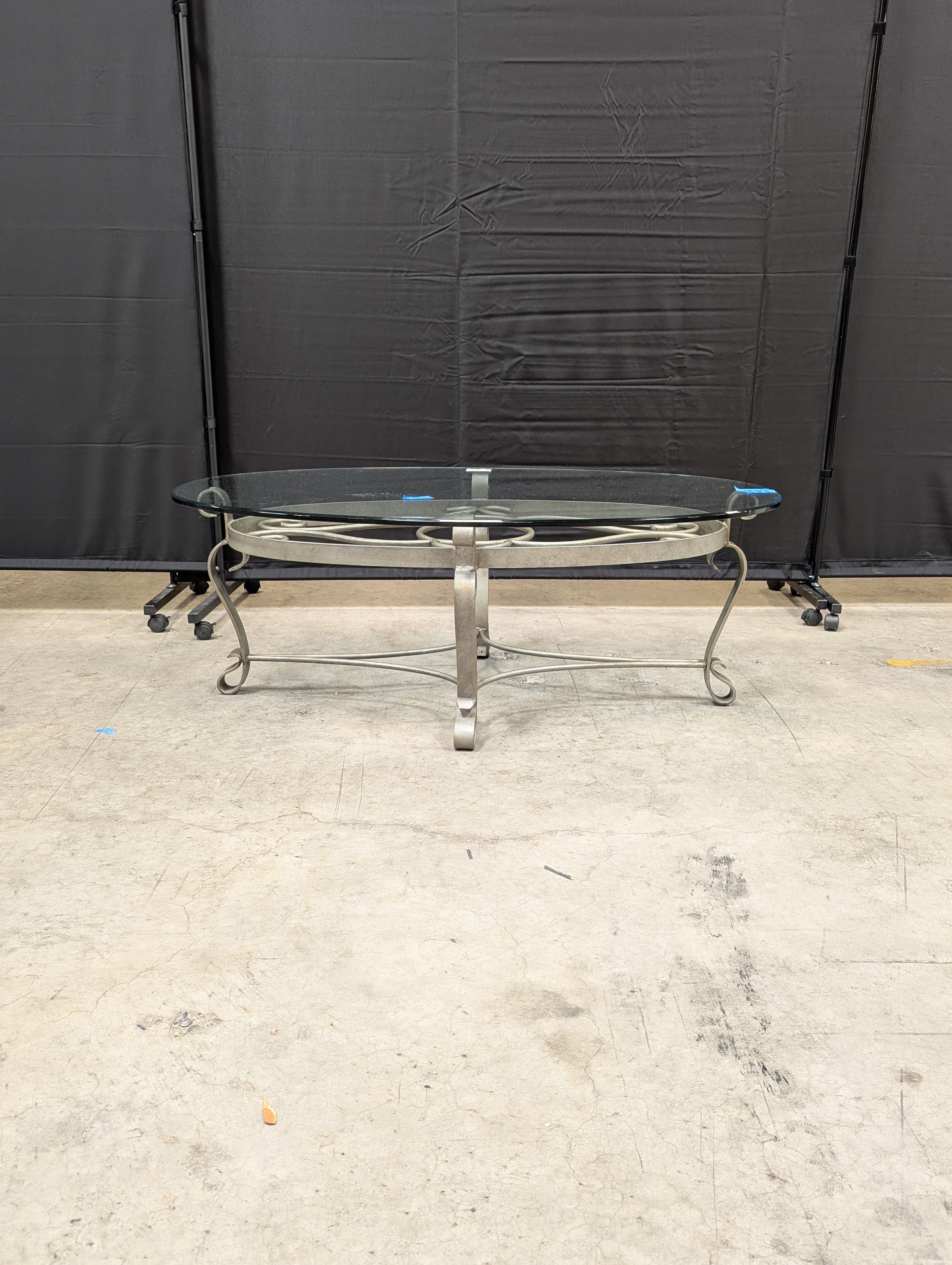 Oval Glass Top Coffee Table with Ornate Scrolled Metal Base