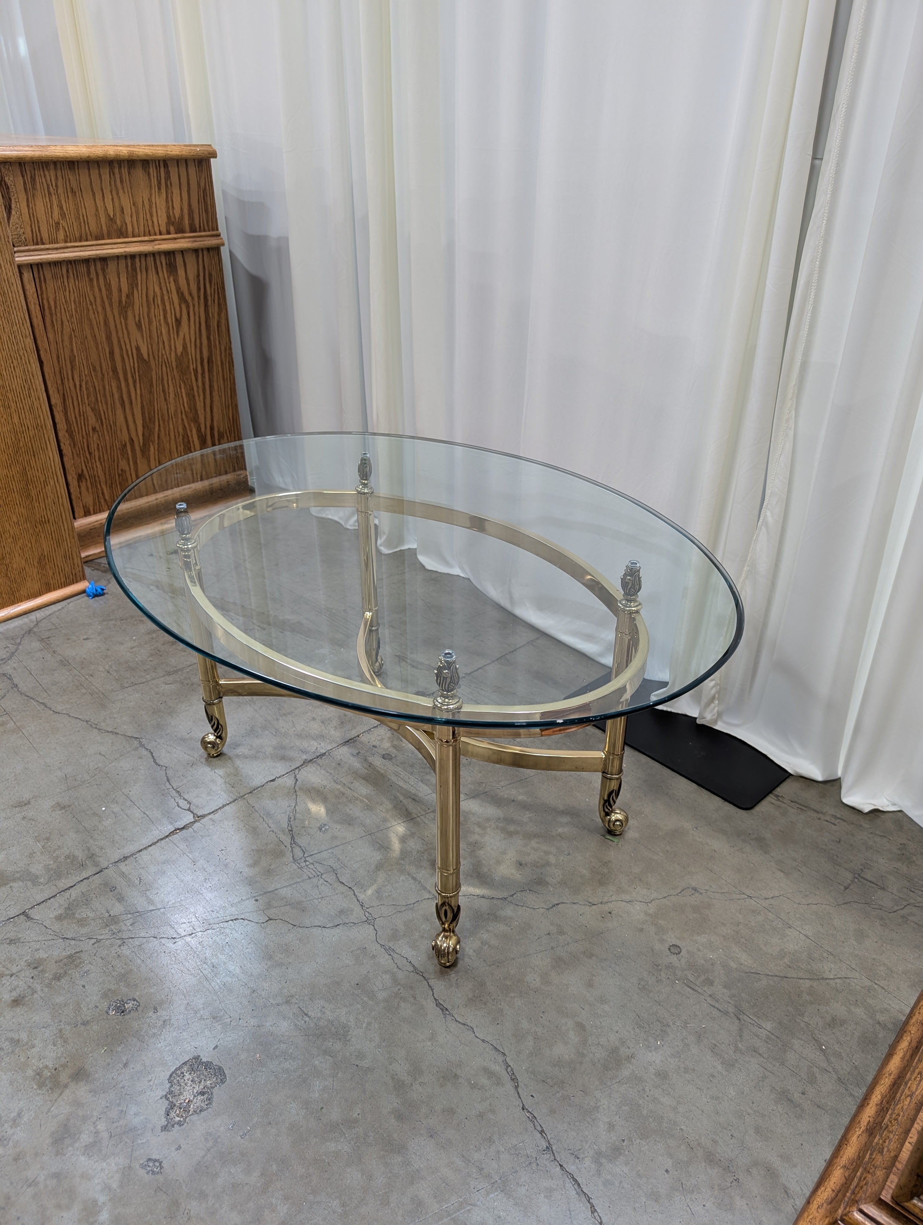 Oval Glass Top Coffee Table with Casters