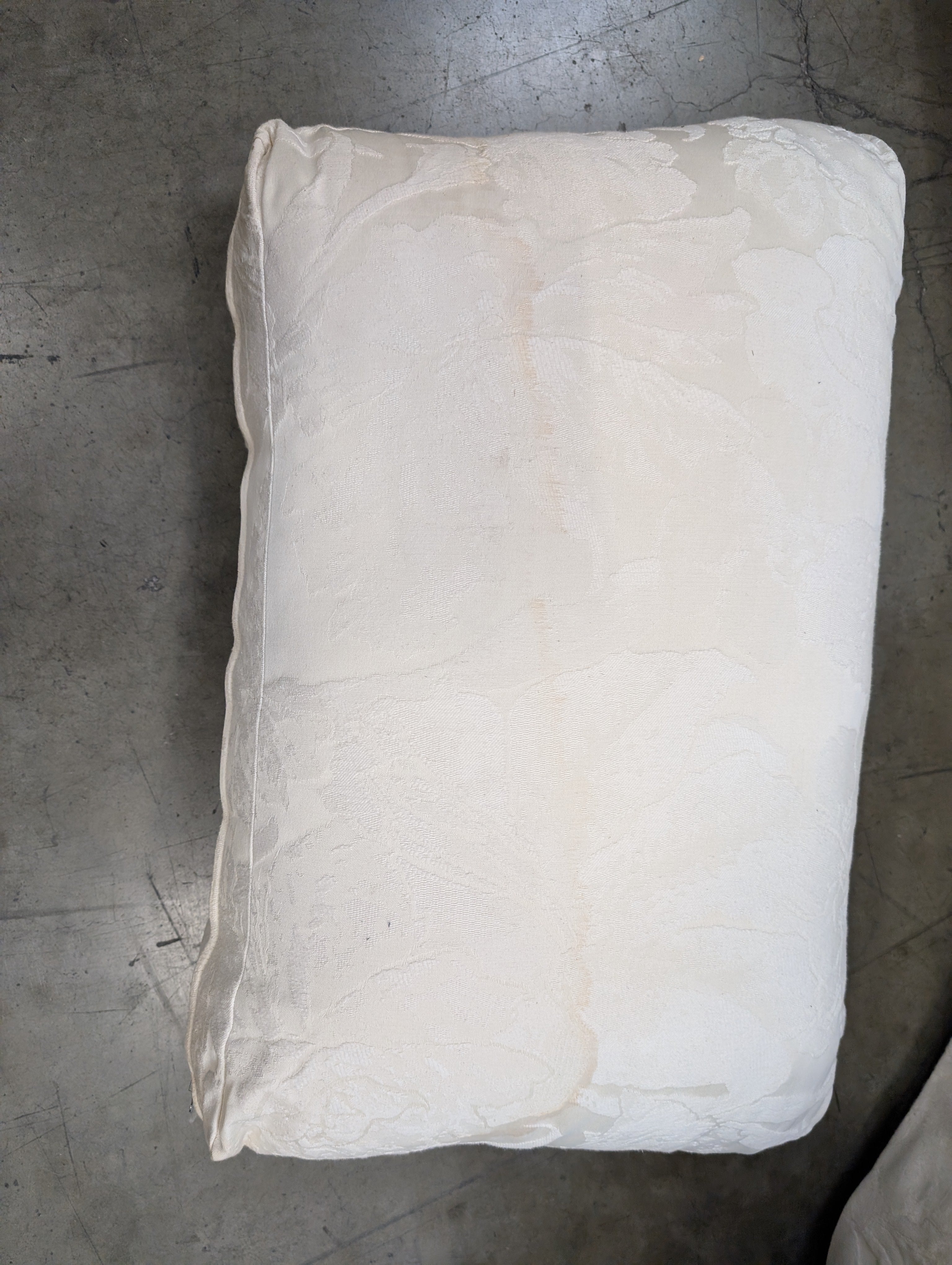 Has a stain Curved Cream Fabric Sectional Sofa with Rolled Arms