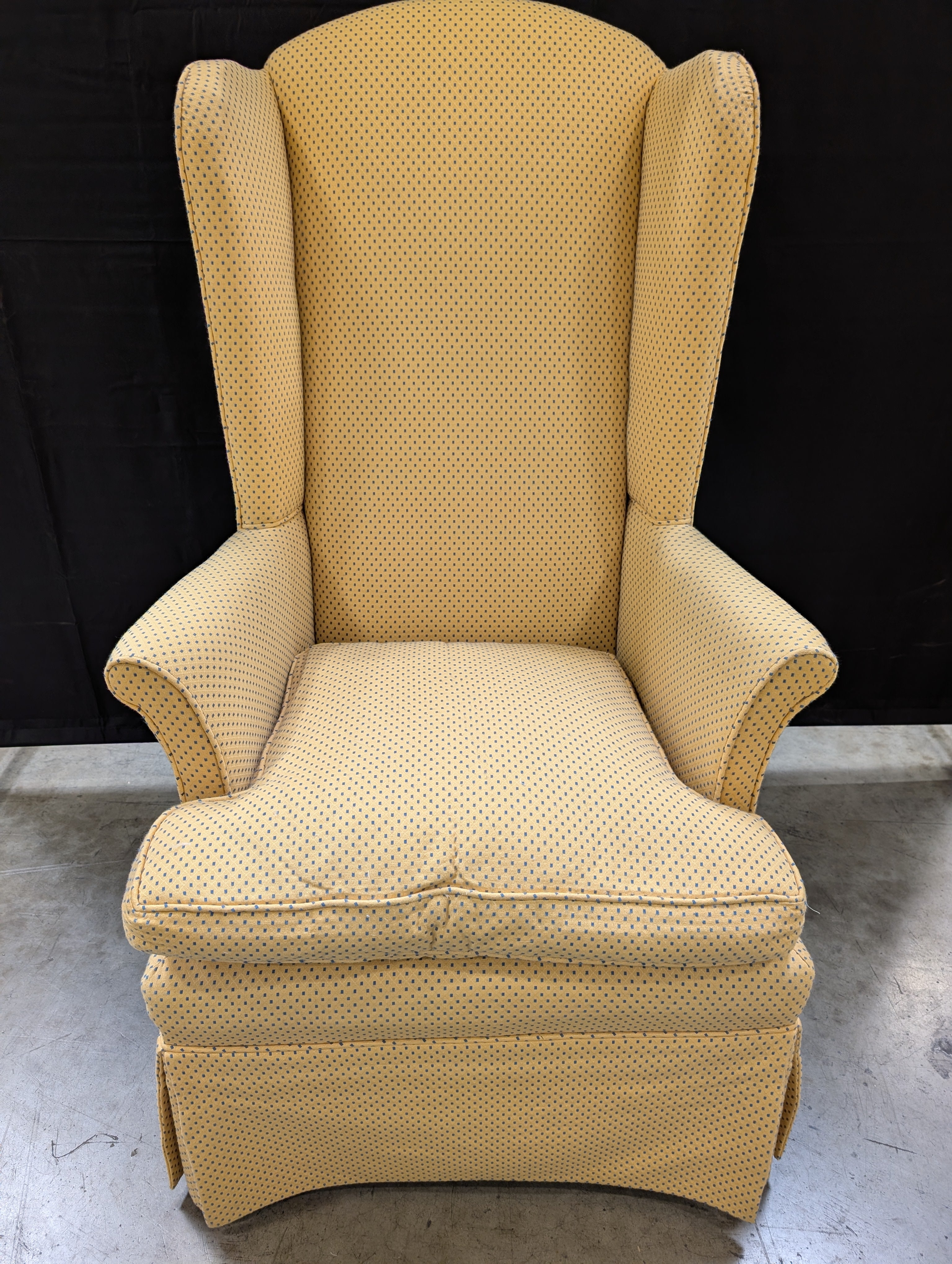 Yellow Wingback Armchair with Skirted Base