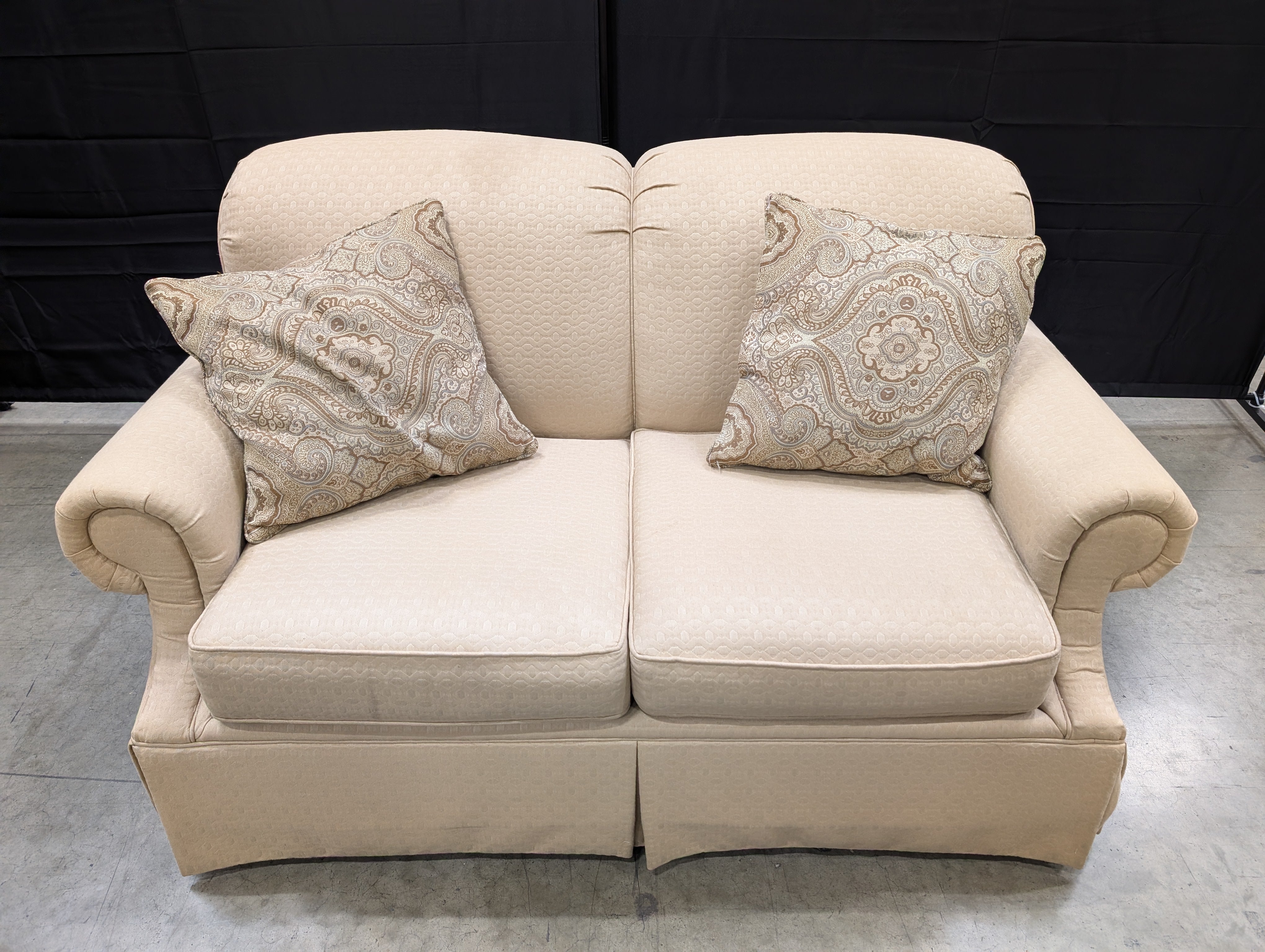 Classic Tan Two-Seater Sofa with Rolled Arms