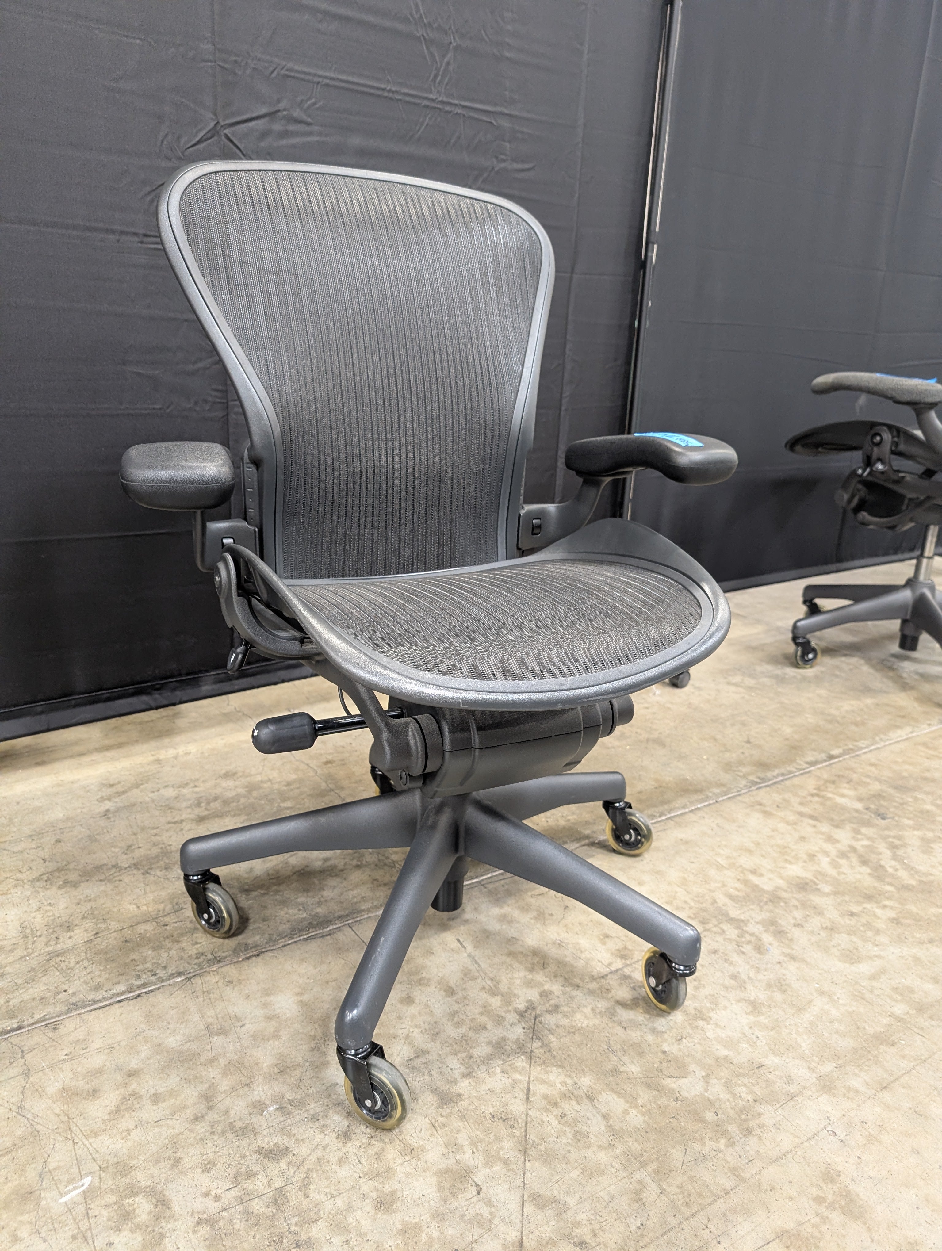 Black Mesh High-Back Herman Miller Office Chair with Headrest