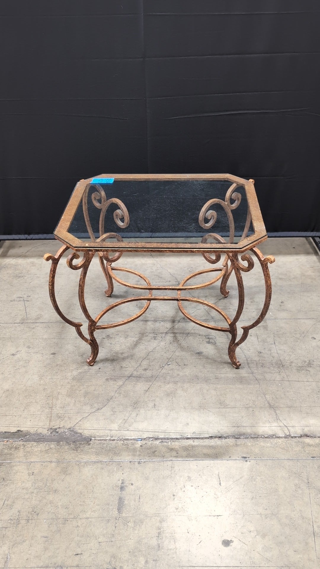 Octagonal Glass Top Accent Table with Scrollwork Metal Base