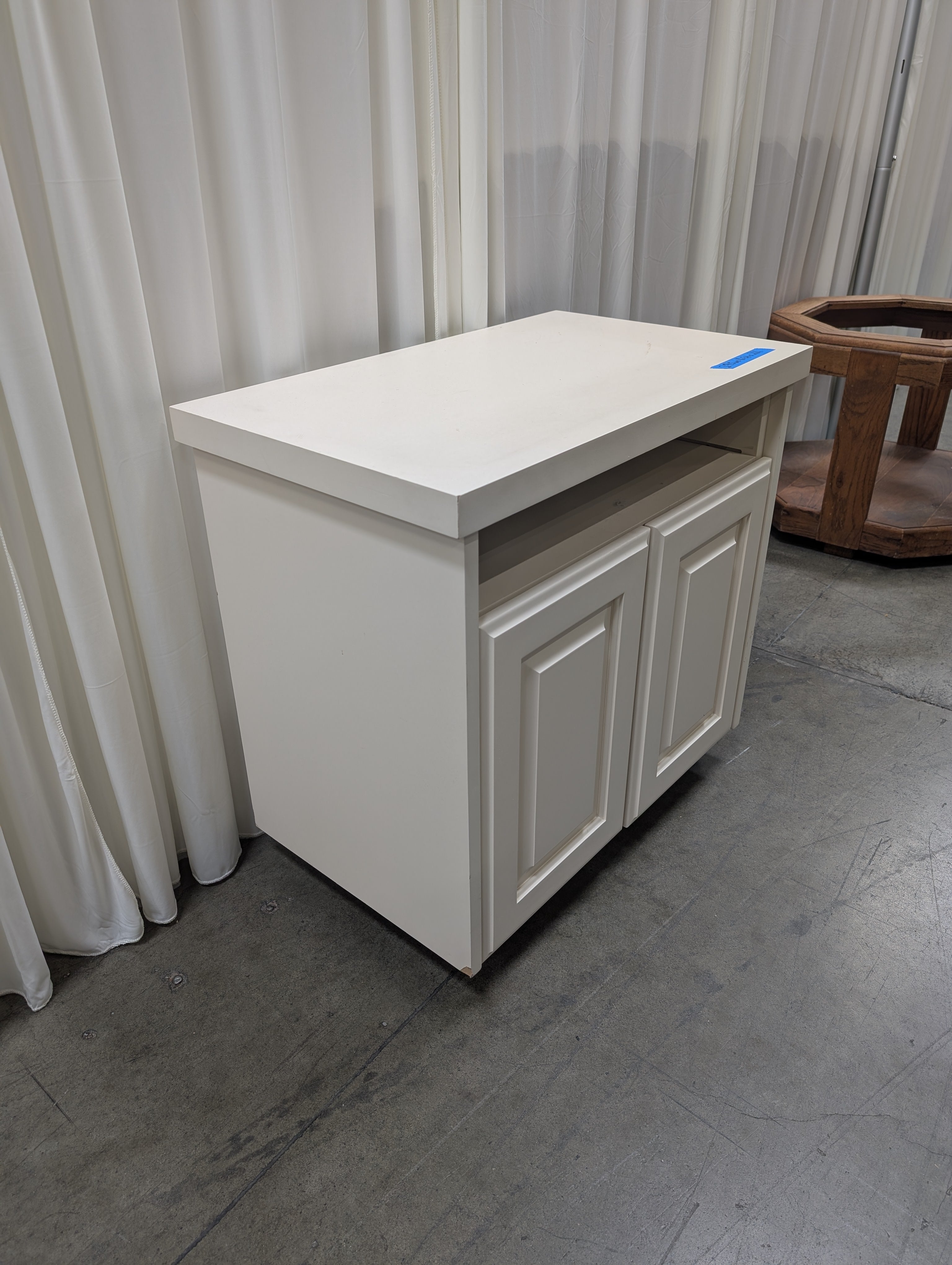 White Wood Two-Door TV Stand with Open Shelf