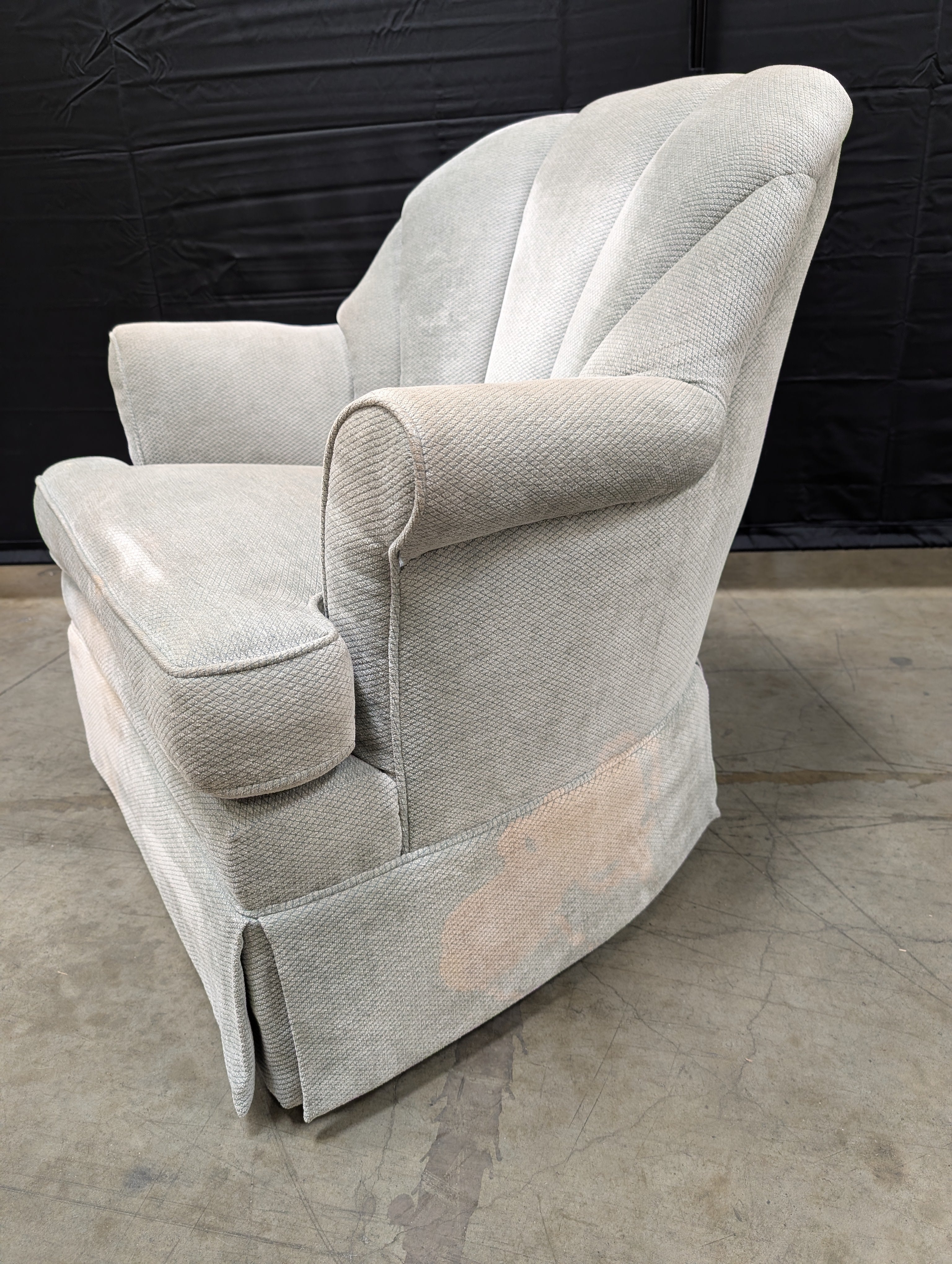 Textured Upholstered Scalloped Back Swivel Armchair