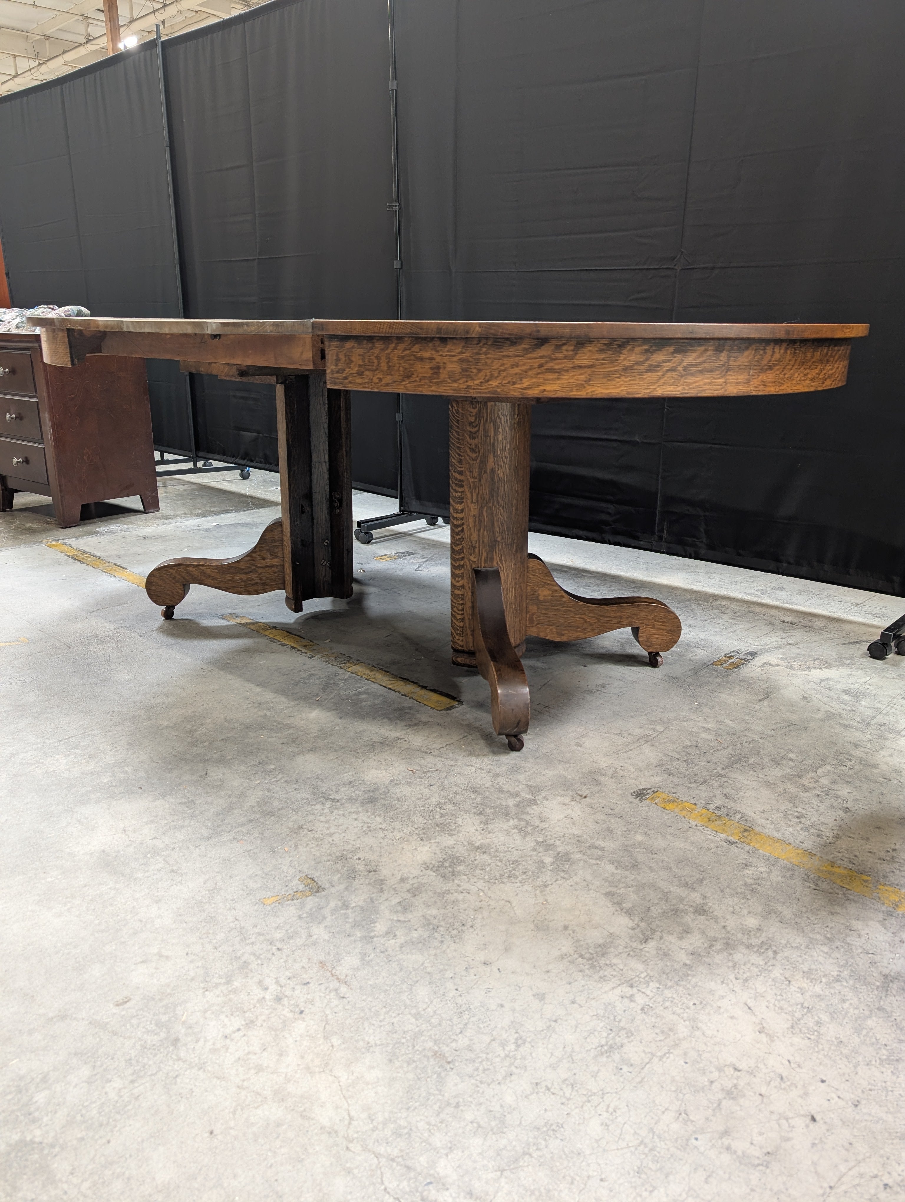 Round Dark Stained Wood Pedestal Dining Table