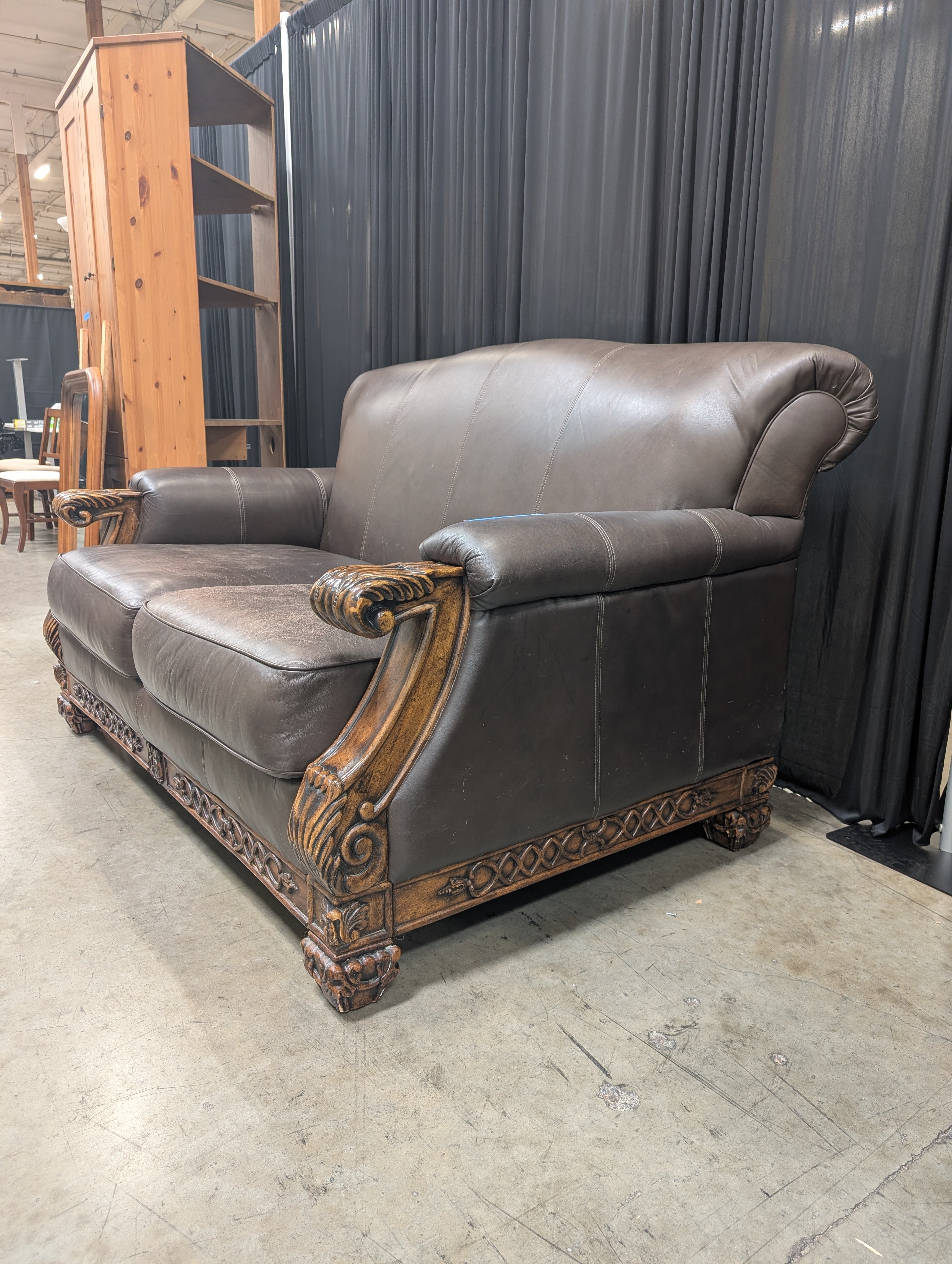 Traditional Brown Leather Loveseat with Carved Wood