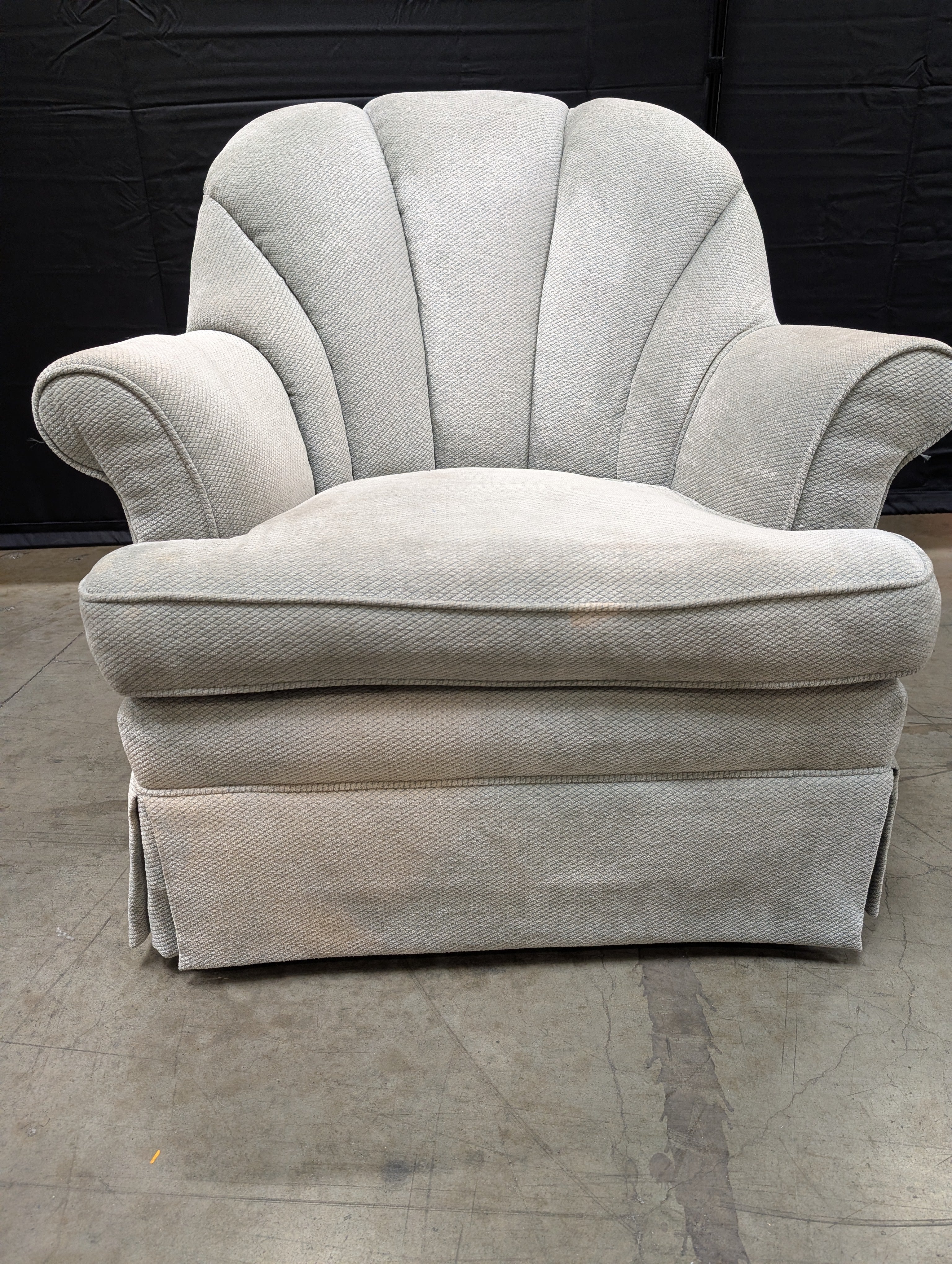 Textured Upholstered Scalloped Back Swivel Armchair