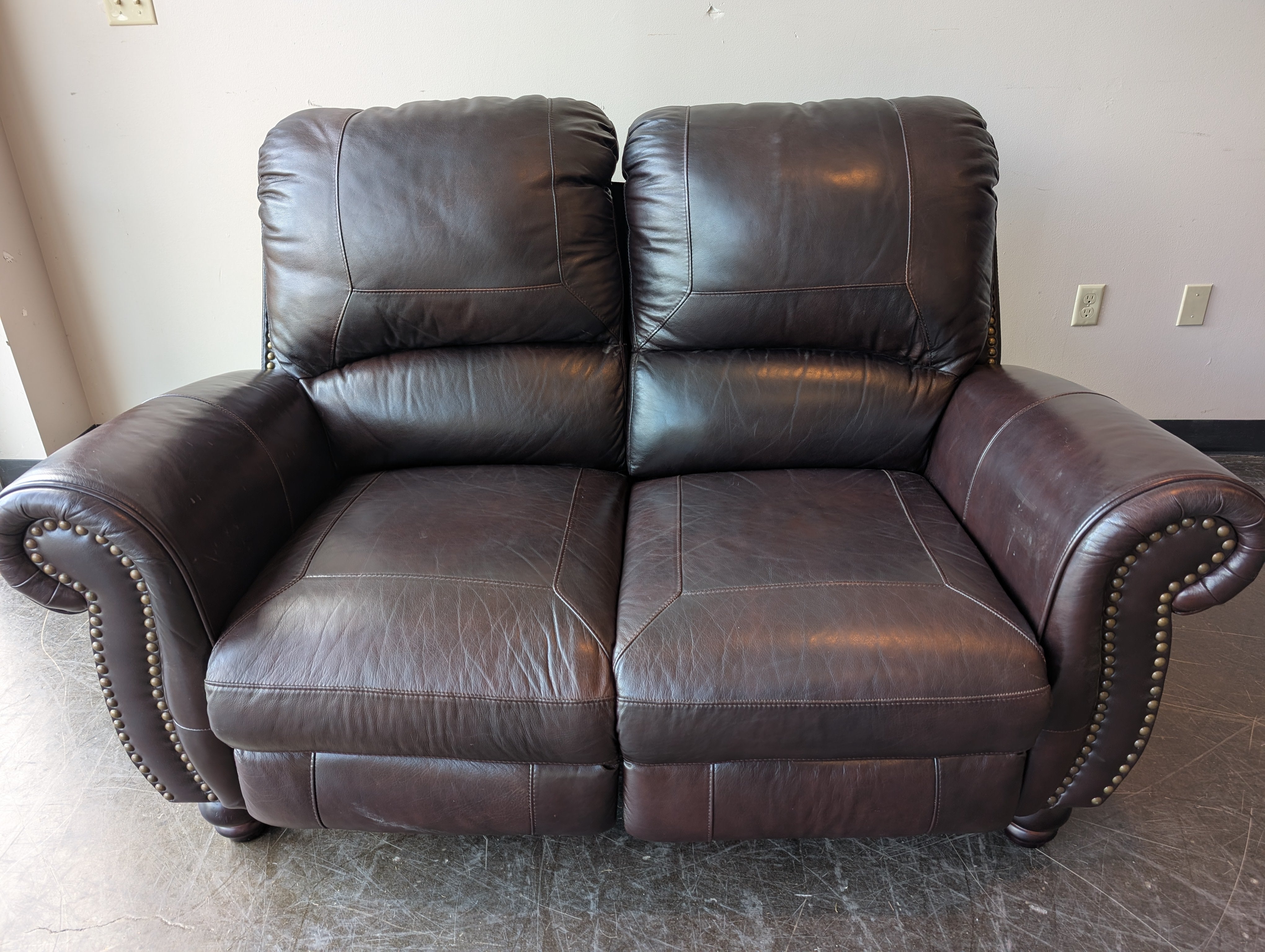 Classic Dark Brown Leather Reclining Loveseat with Nailhead Trim