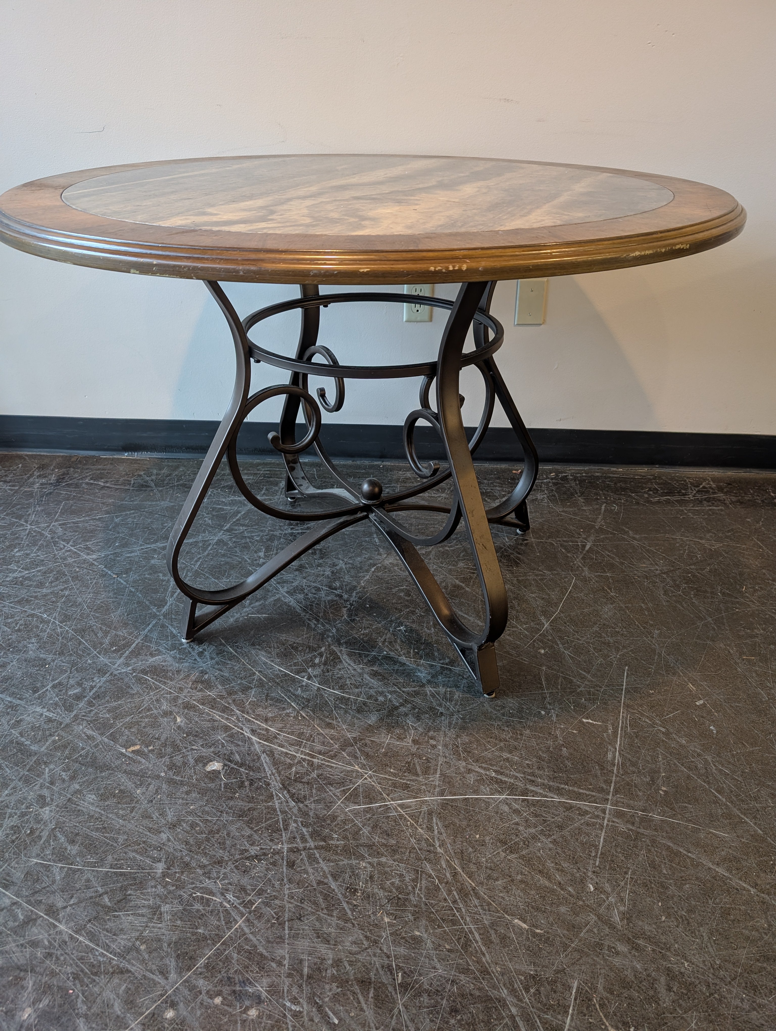 Round Stone Top Dining Table with Wood Trim and Metal Pedestal Base