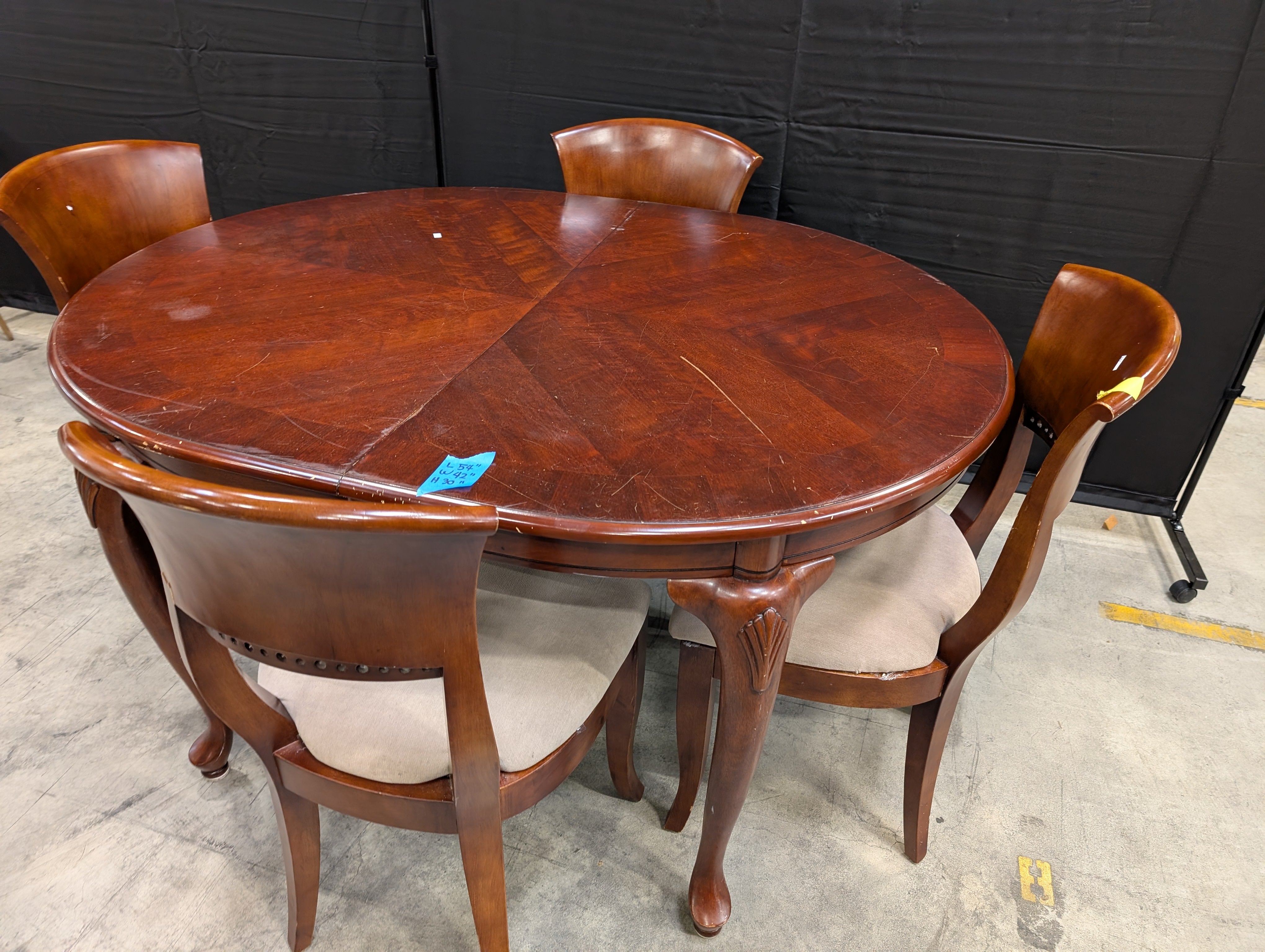 Traditional Dark Wood Oval Dining Table with Four Upholstered Chairs