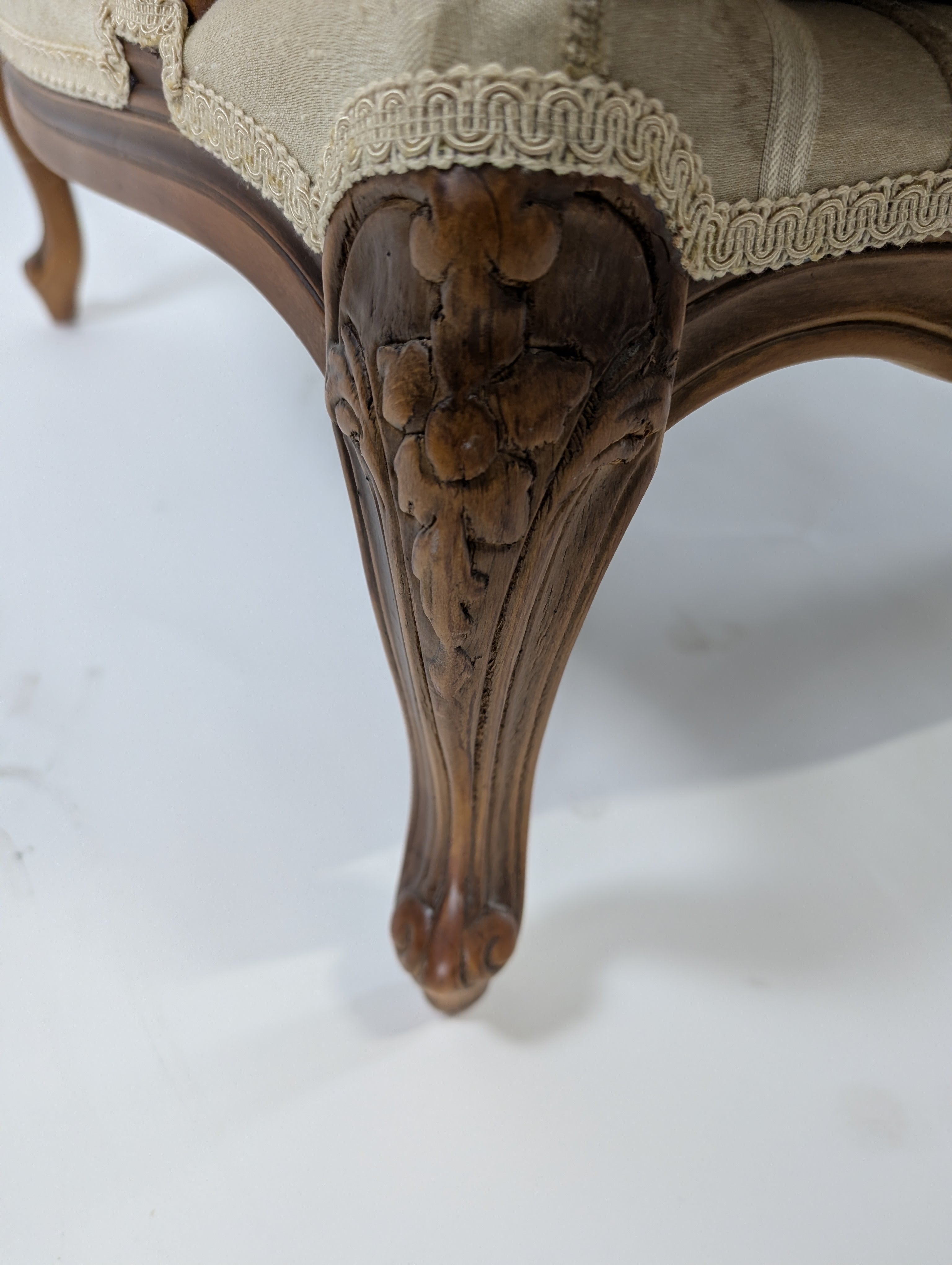 Ornate Carved Wood Armchair with Striped Upholstery