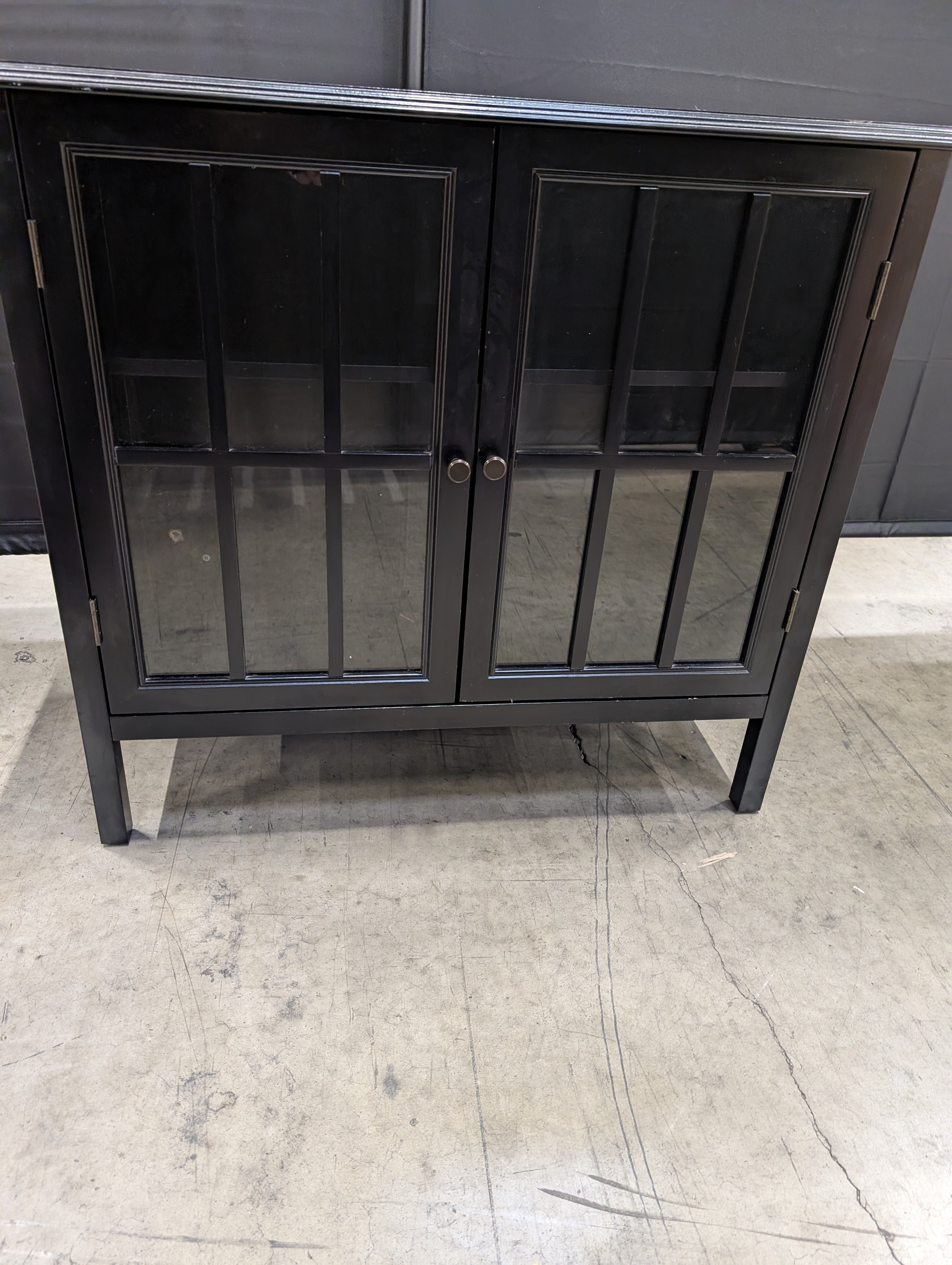 Stylish Black Wood Storage Cabinet with Glass Grid Doors and Tapered Legs