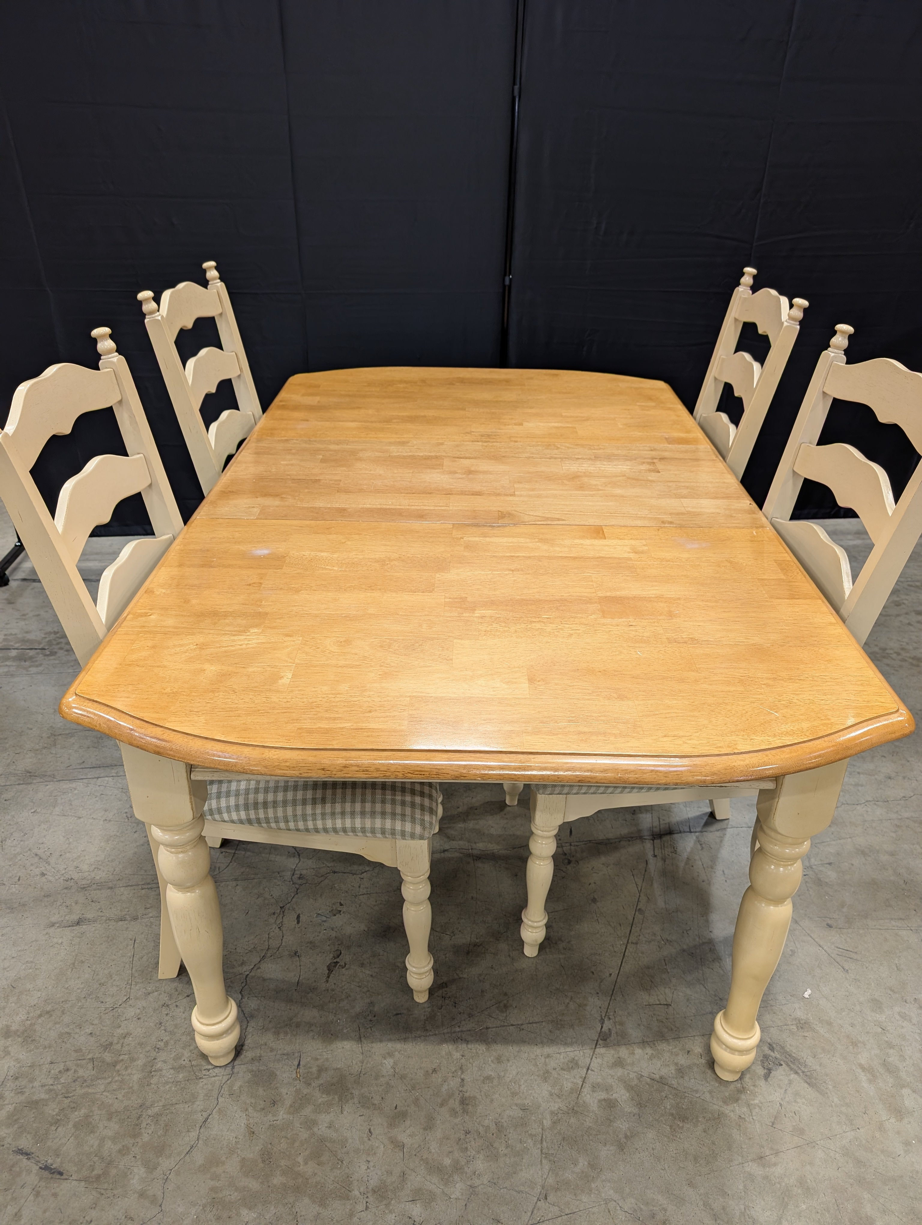 Rustic Wood Dining Table with Four Ladder-Back Chairs