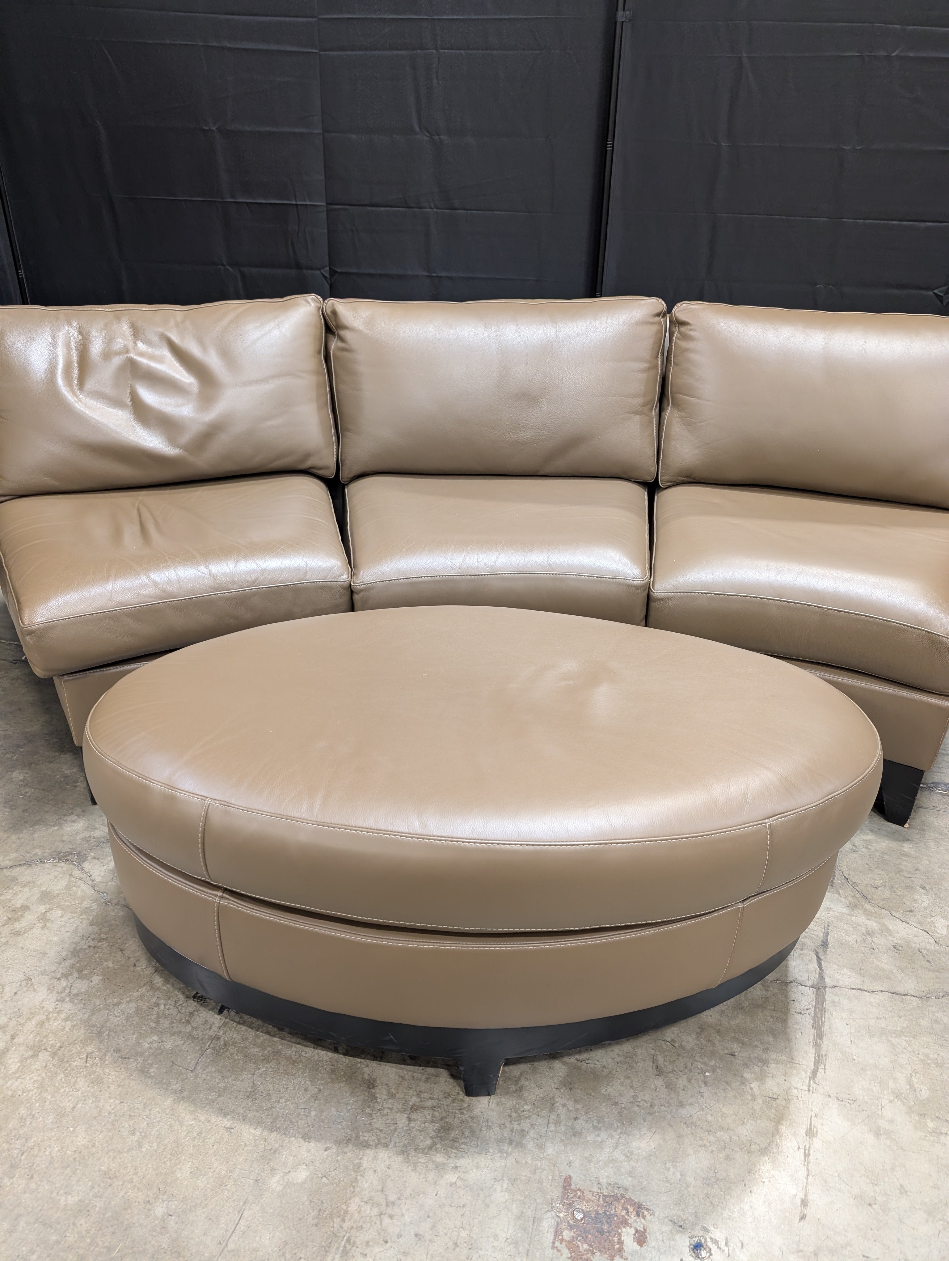 Contemporary Brown Leather Curved Sectional Sofa with Matching Round Ottoman