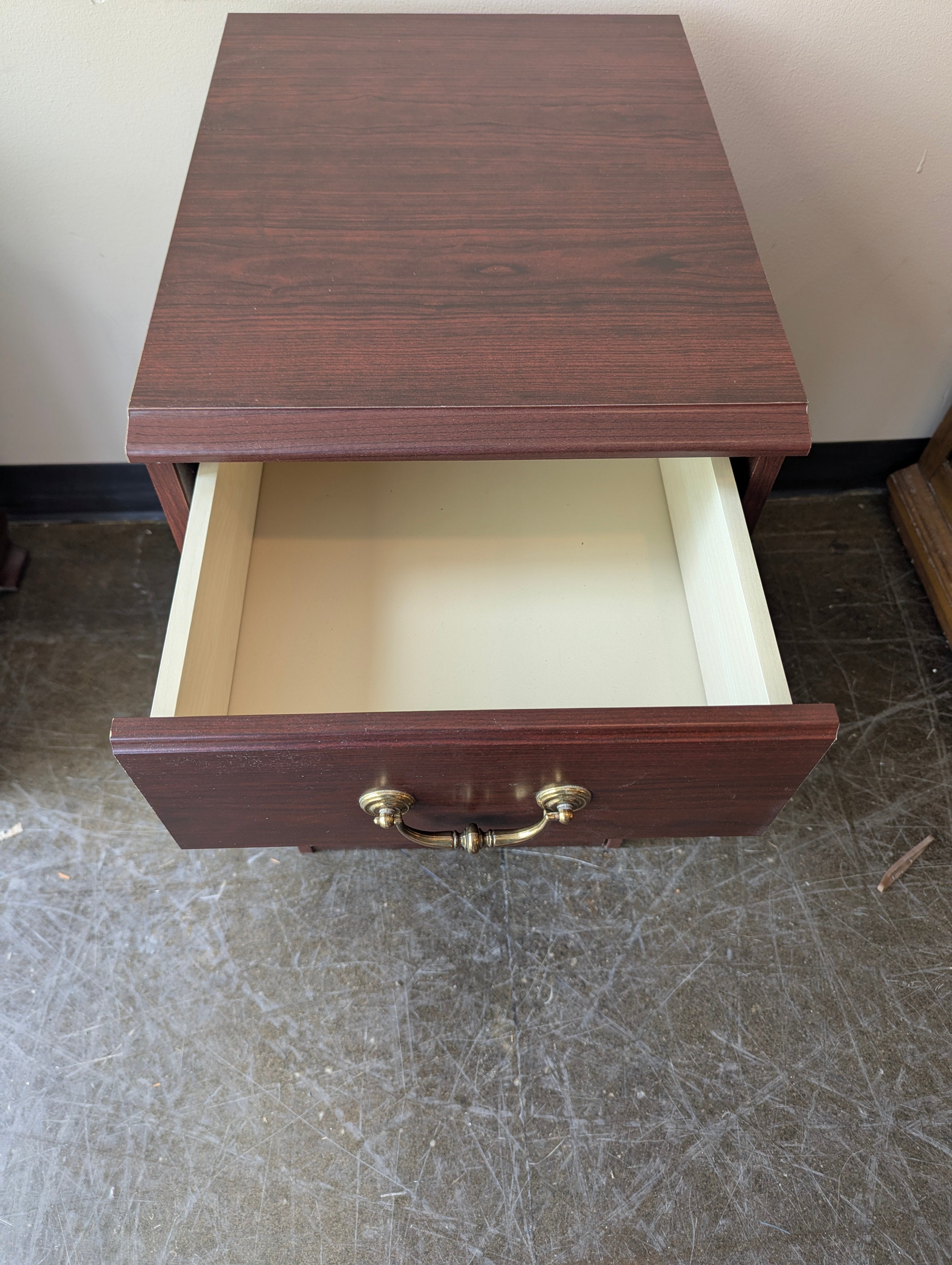 Compact Dark Wood Three-Drawer Storage Cabinet