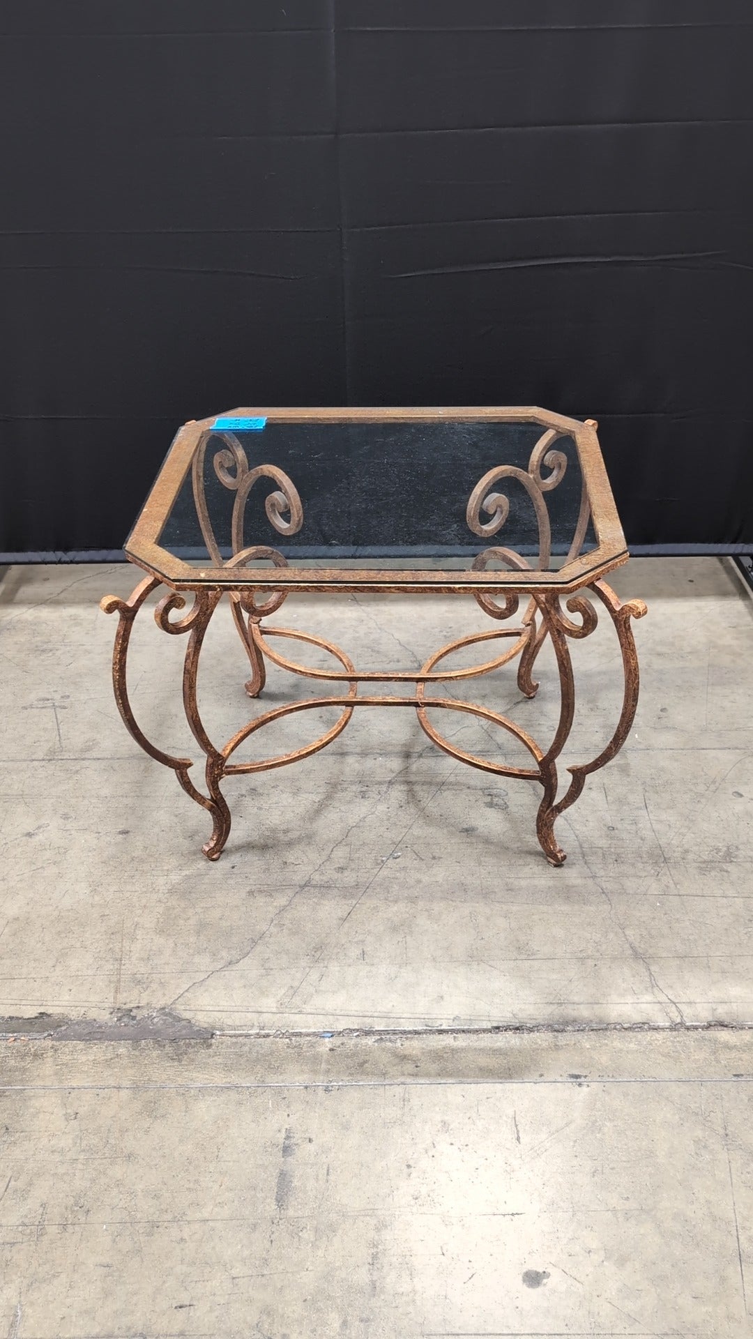 Octagonal Glass Top Accent Table with Scrollwork Metal Base