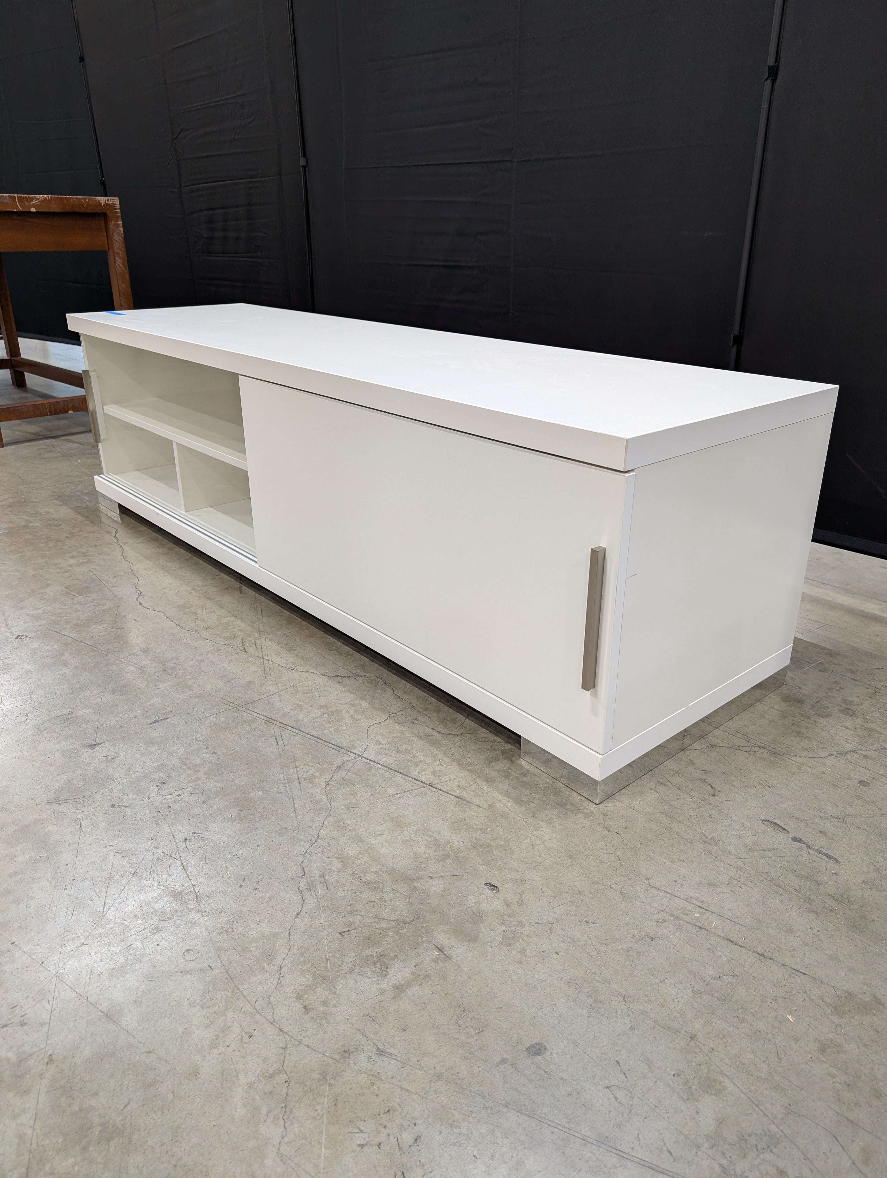 Sleek White Entertainment Unit with Sliding Doors