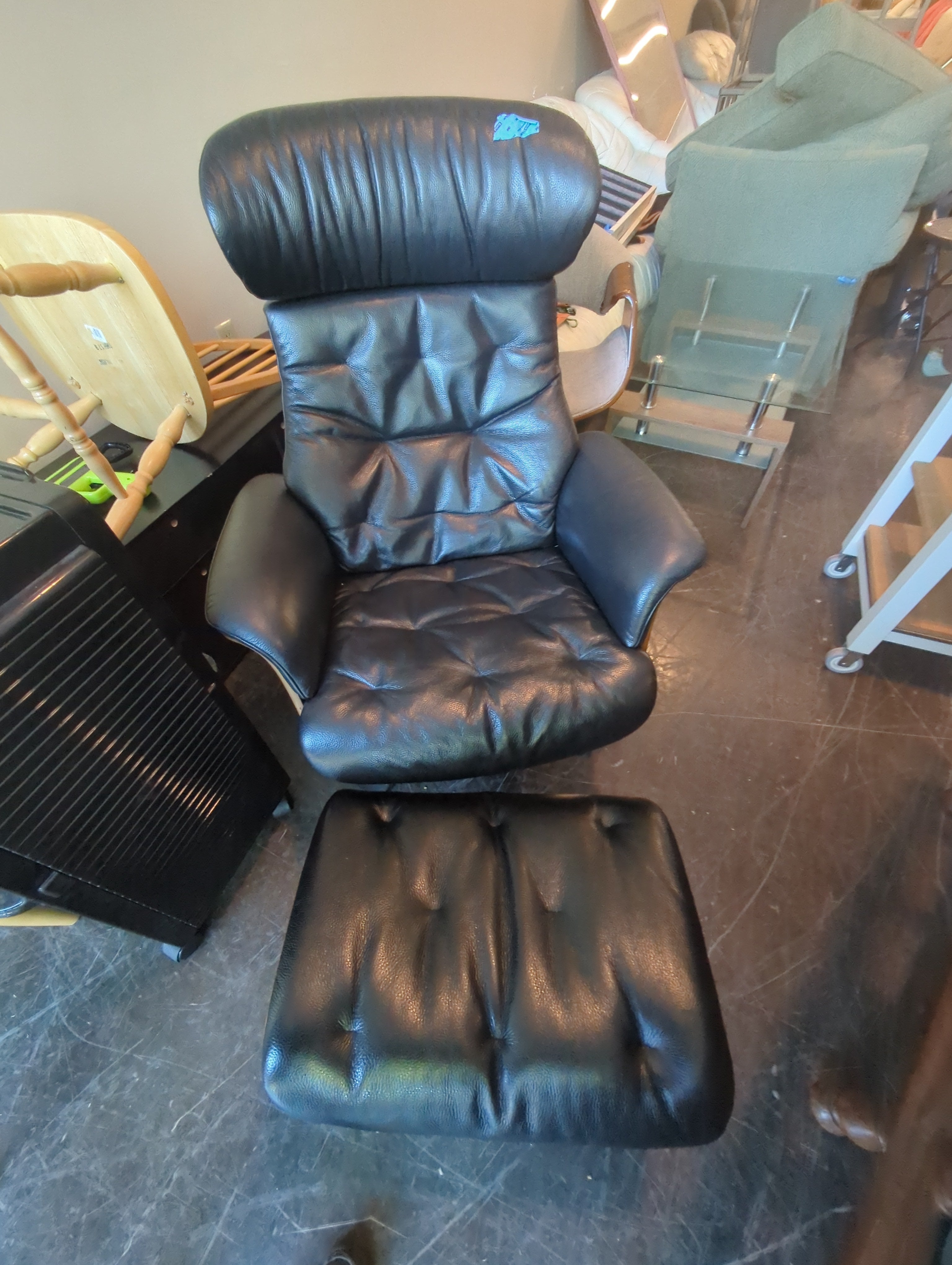 Luxurious Black Leather Recliner and Ottoman Set