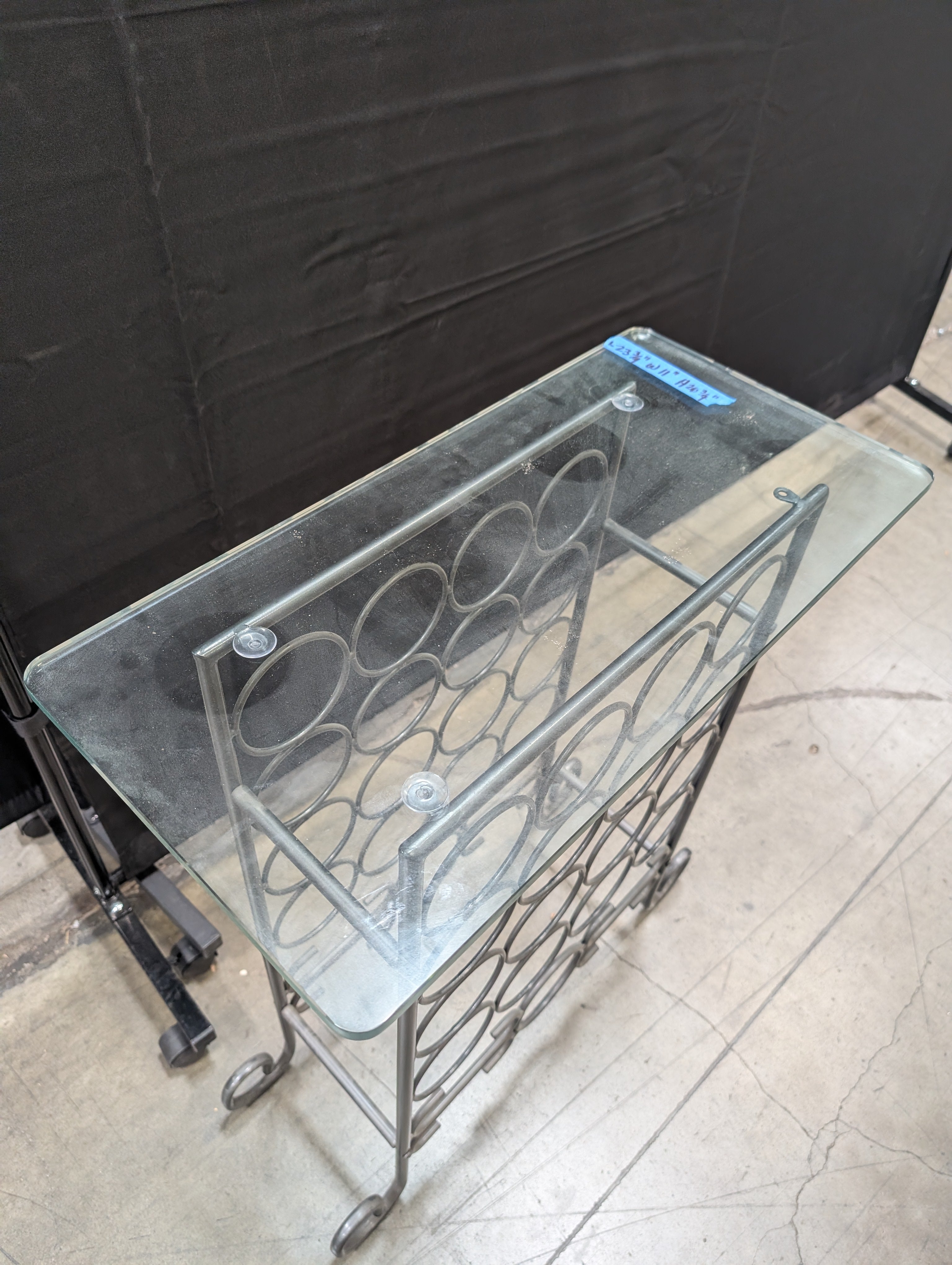 Industrial Style Metal Wine Rack with Glass Top and Wheels