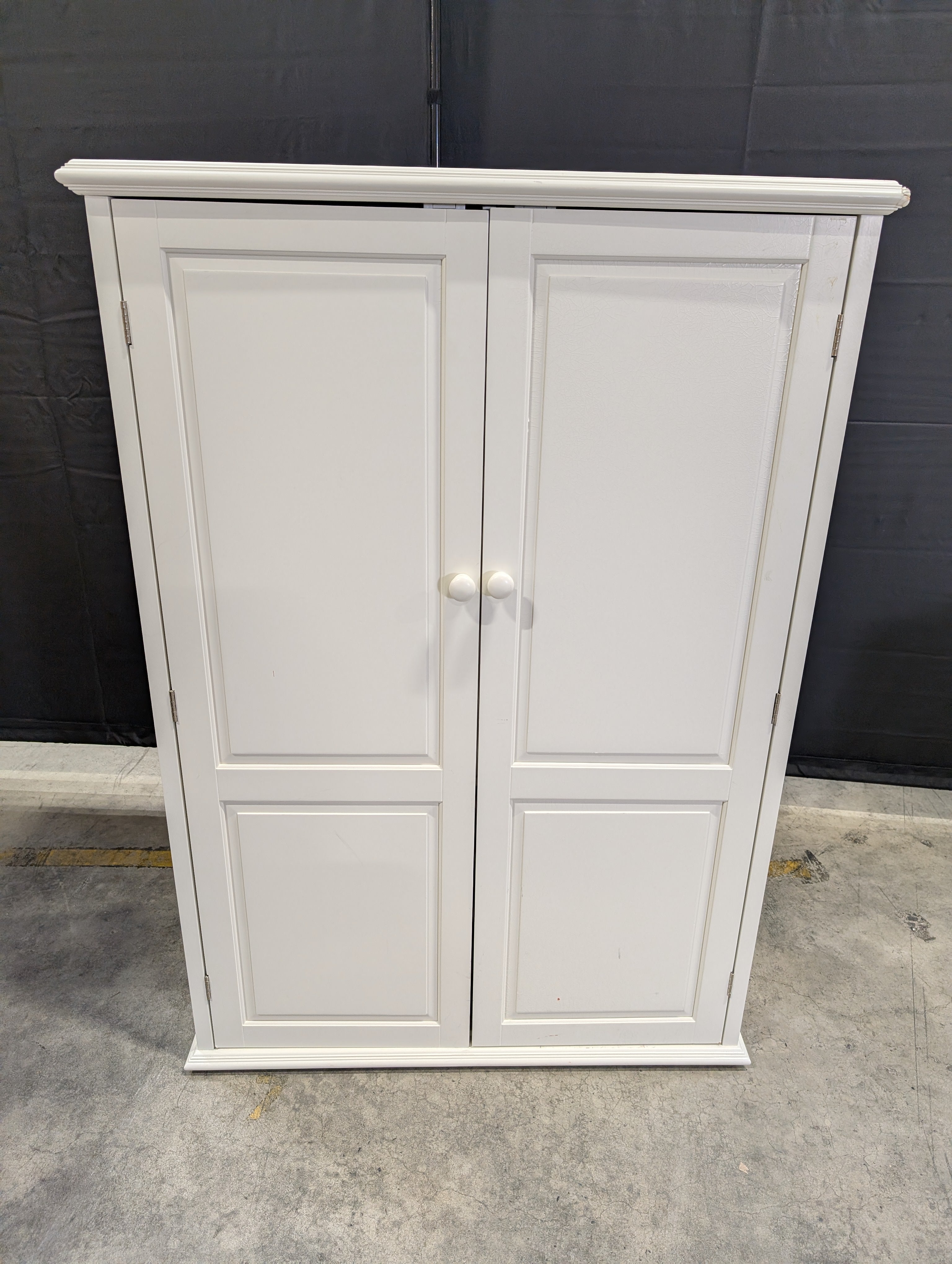 Versatile White Storage Cabinet with Paneled Doors
