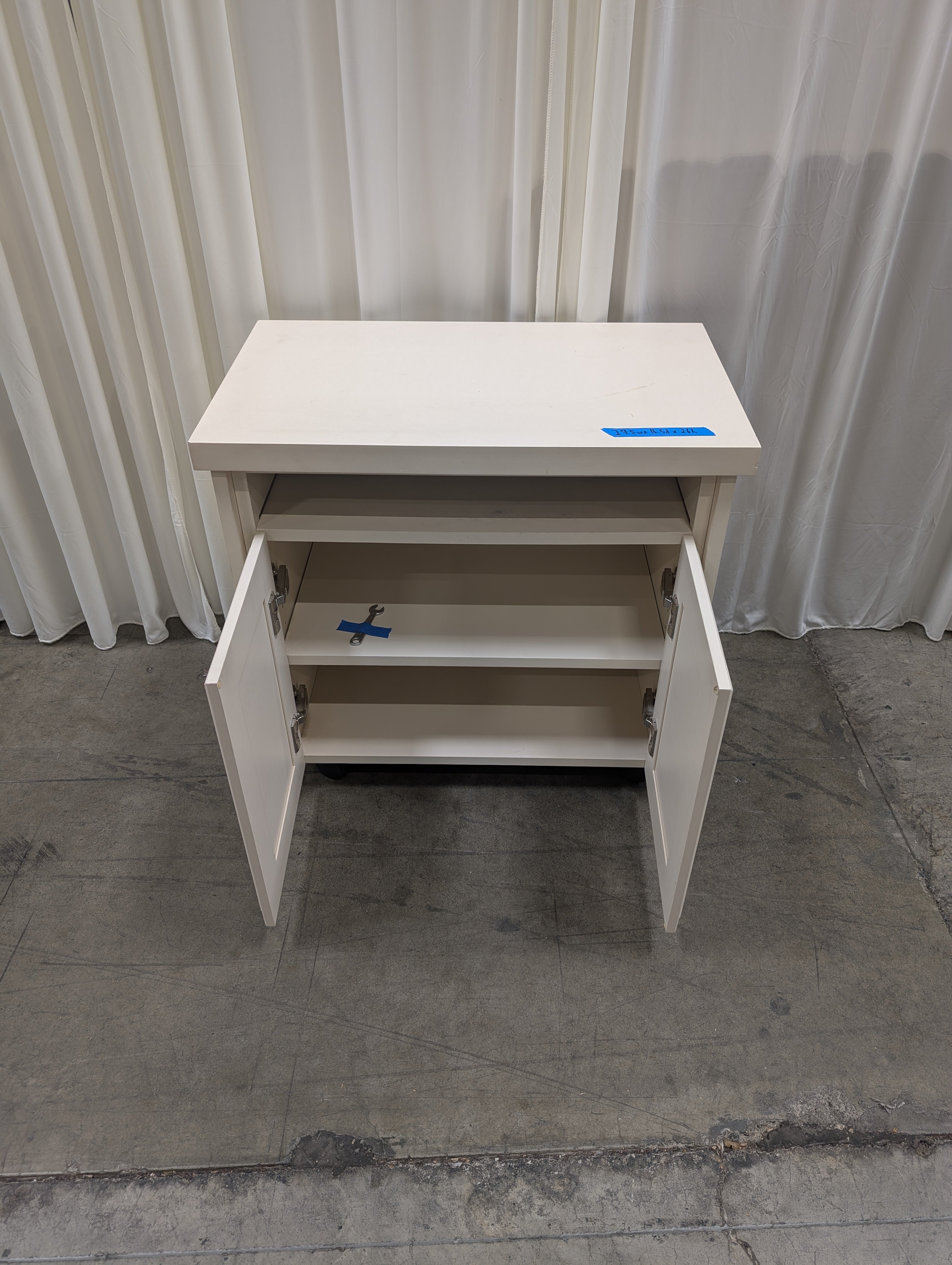 White Wood Two-Door TV Stand with Open Shelf