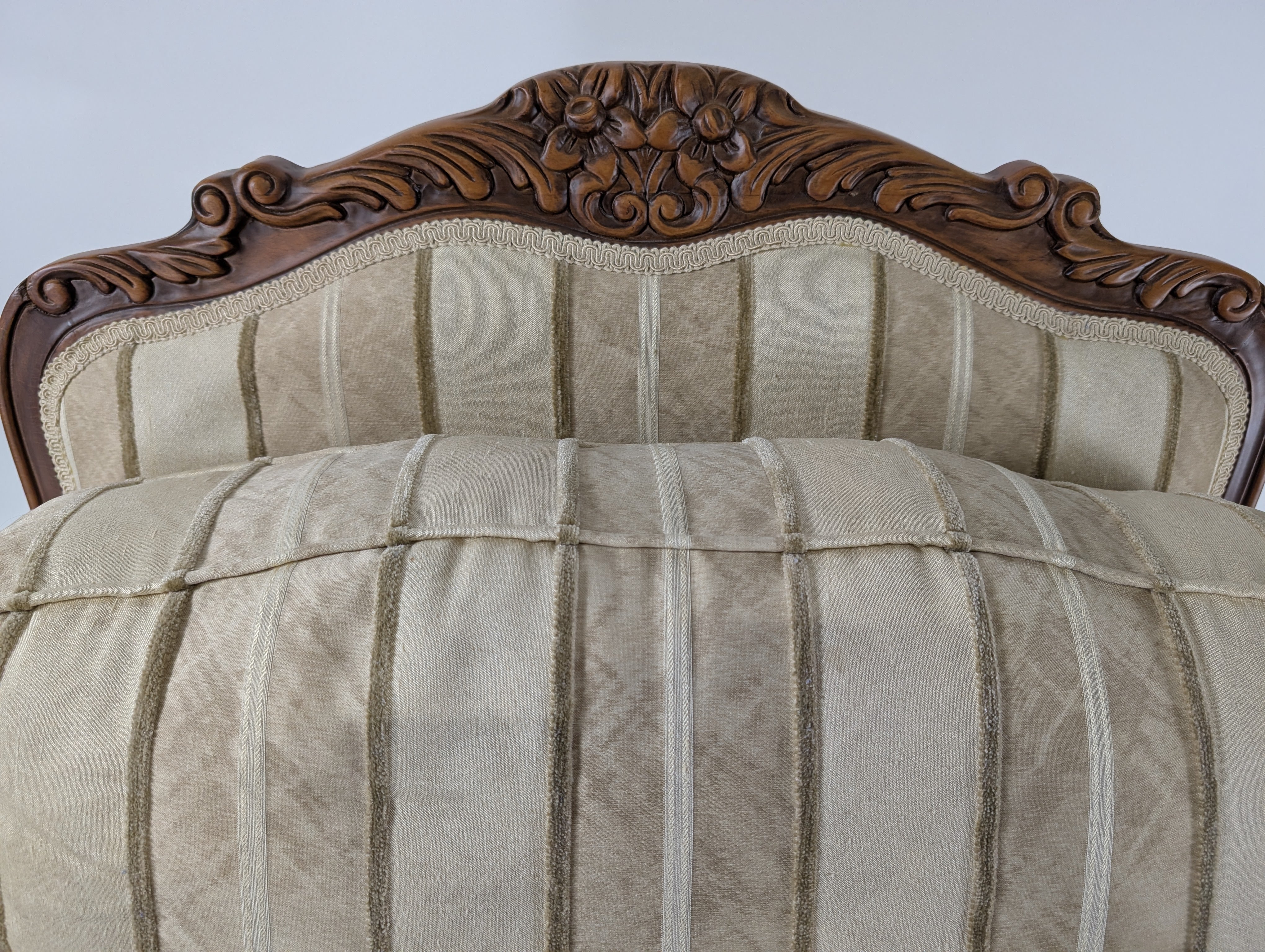 Ornate Carved Wood Armchair with Striped Upholstery