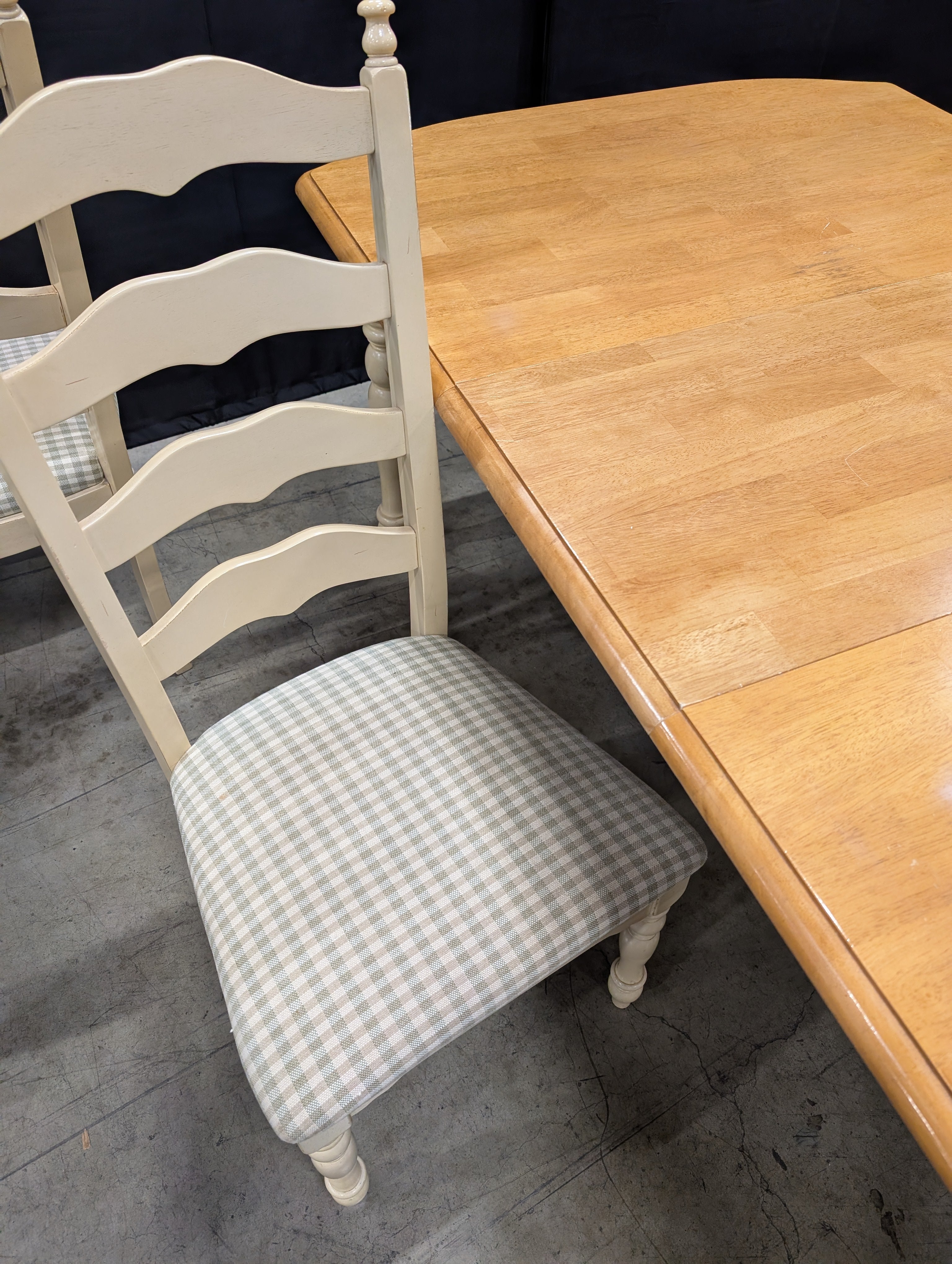 Rustic Wood Dining Table with Four Ladder-Back Chairs
