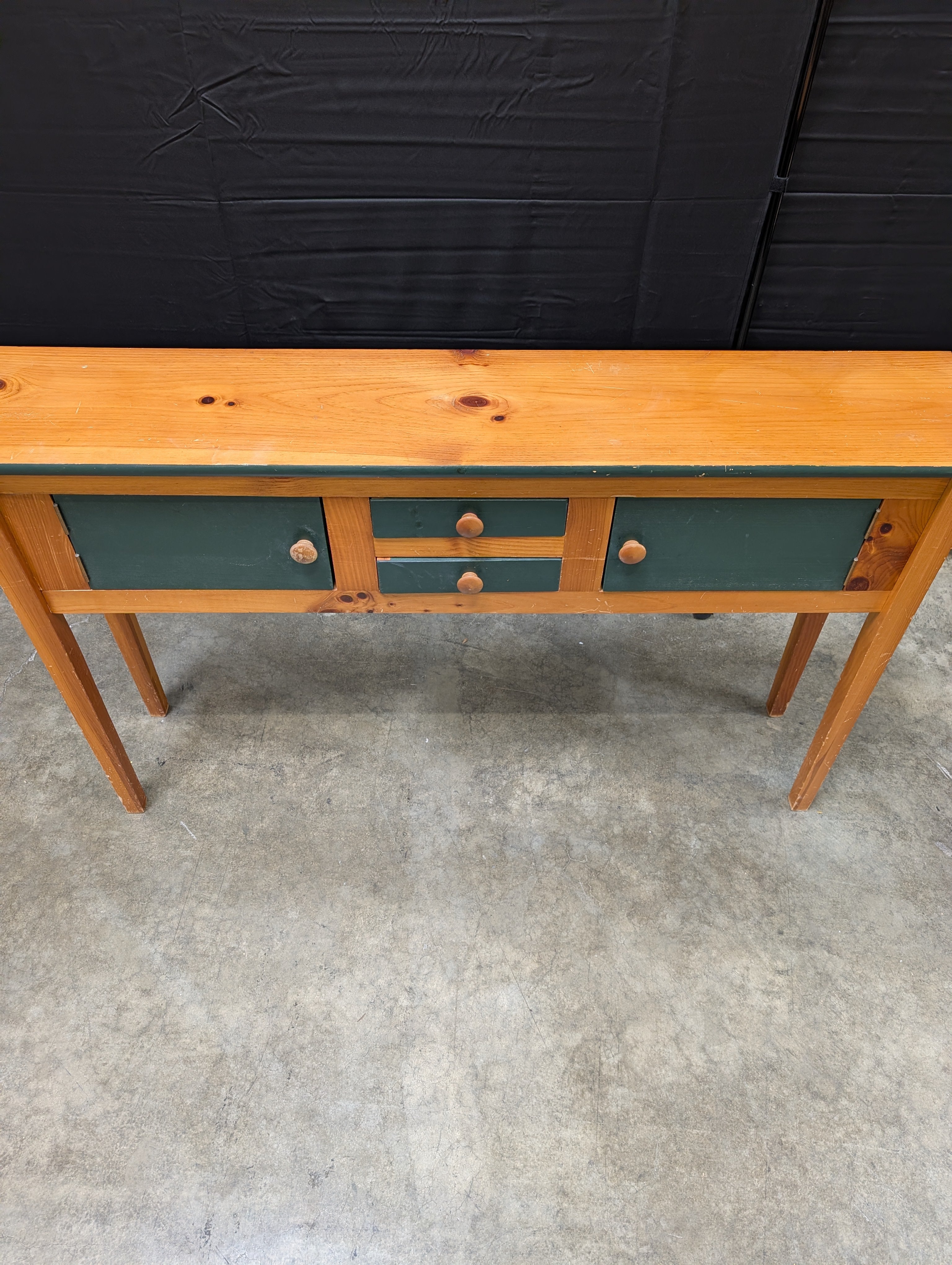 Rustic Wood Console Table with Dark Green Cabinetry
