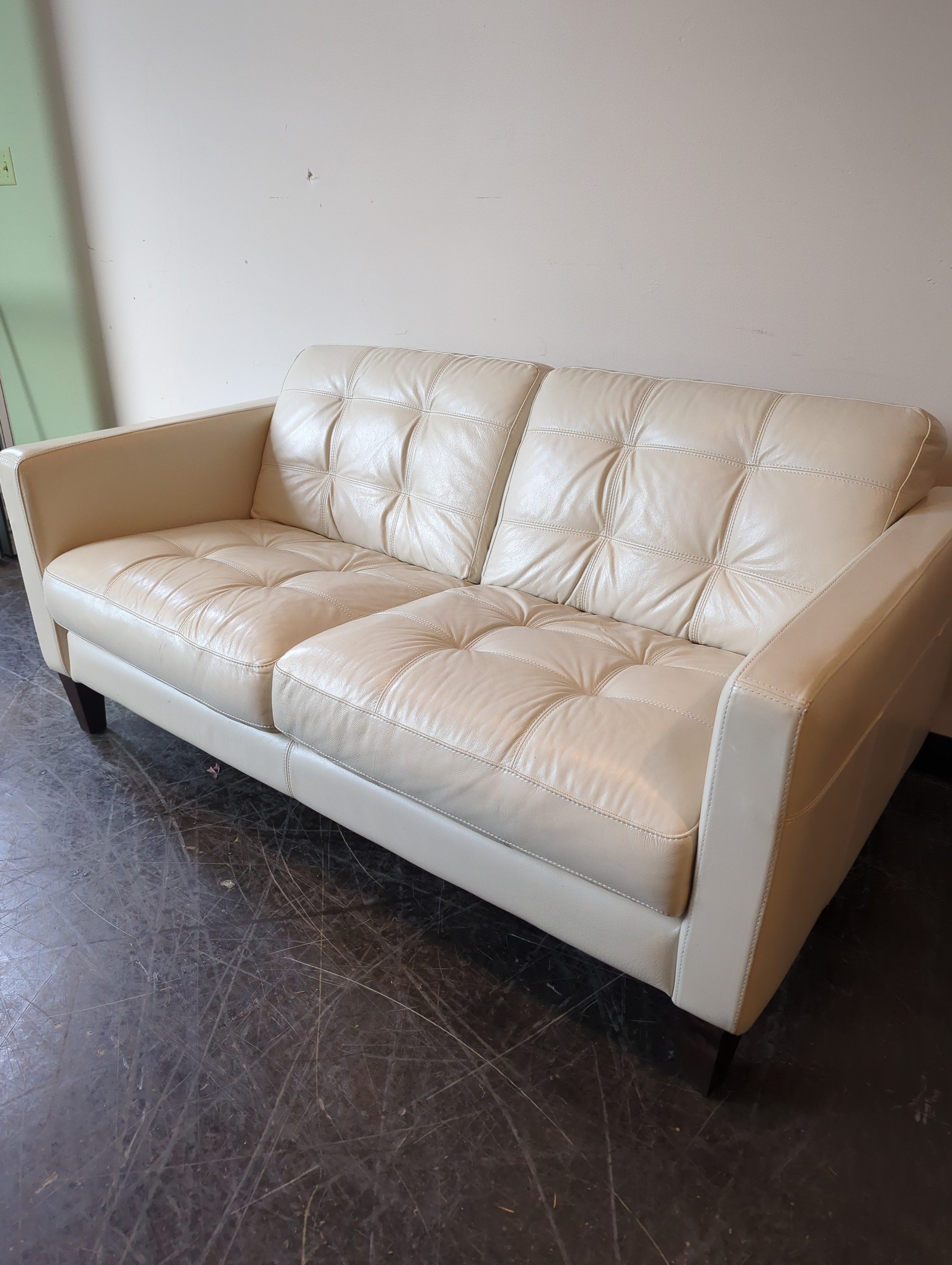 Chateau d'Ax Cream Leather Two-Seater Sofa with Tufted Cushions
