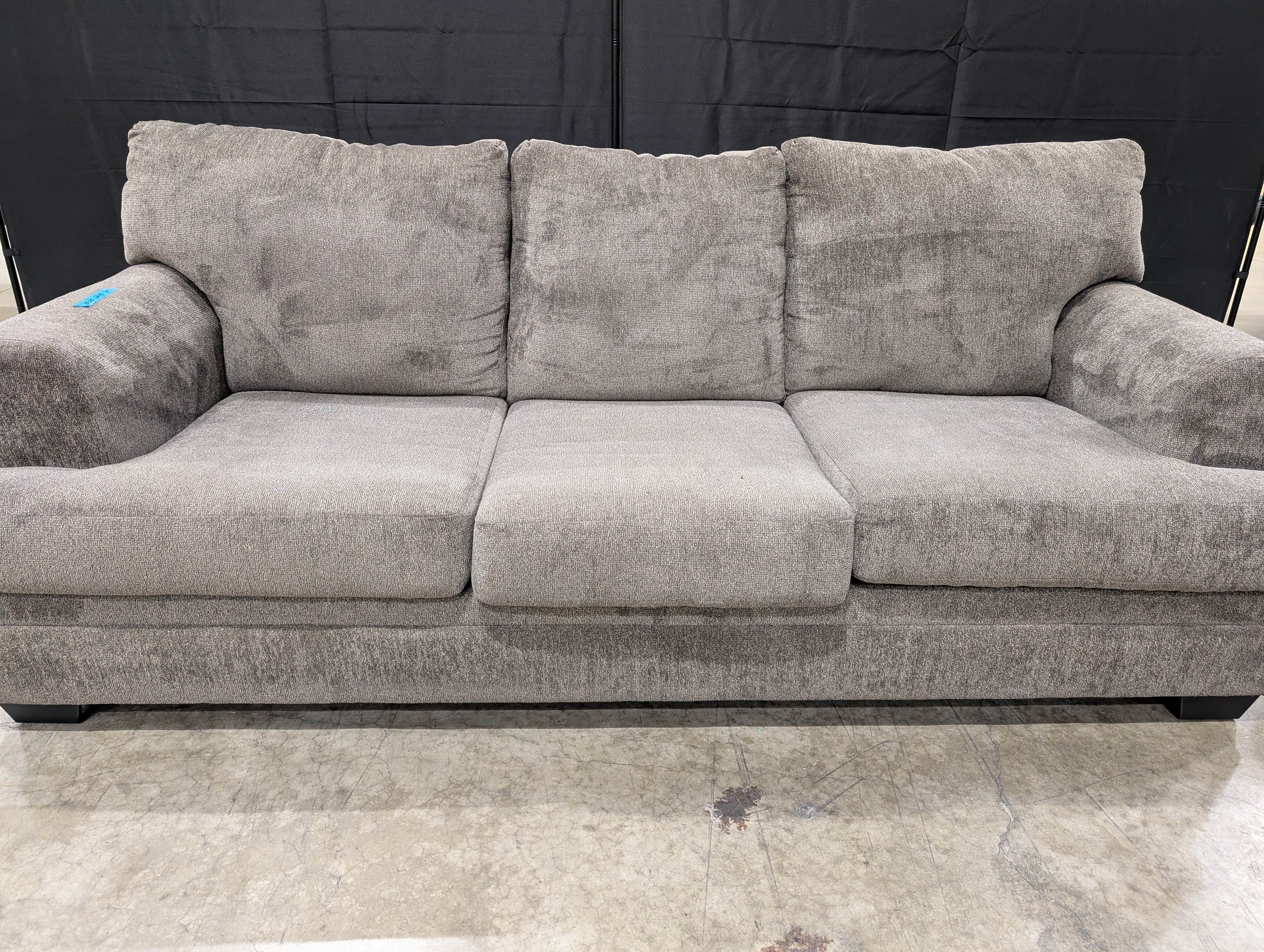 Comfortable Gray Upholstered Three-Seat Sofa