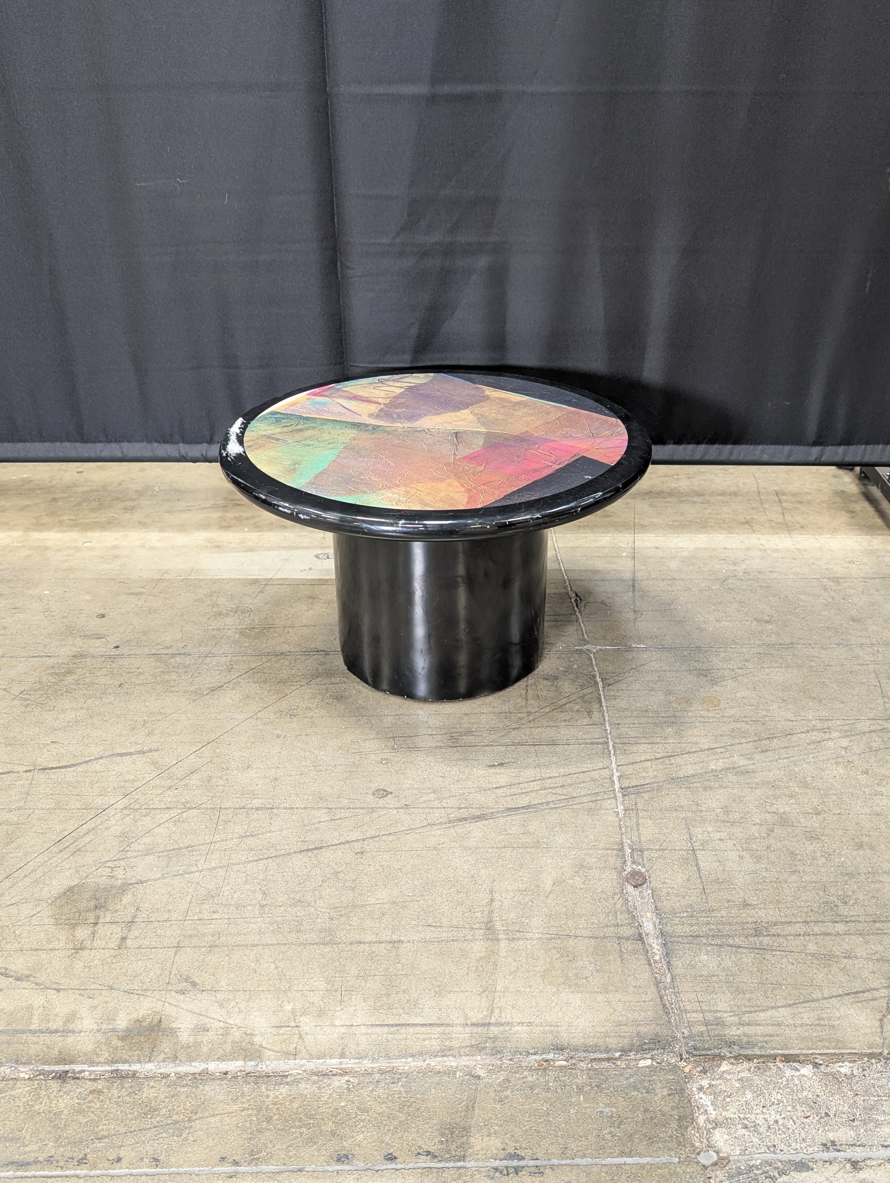 Striking Round Pedestal Coffee Table with Iridescent Top