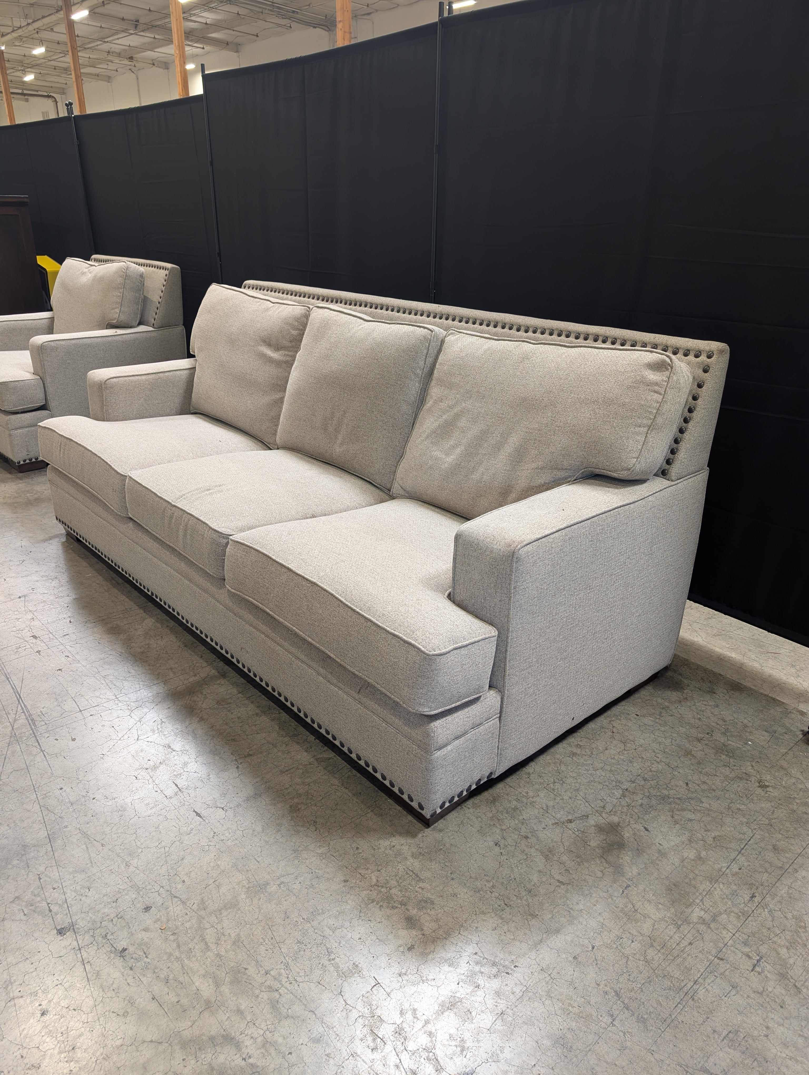 Grey Fabric Three-Seat Couch with Nailhead Trim