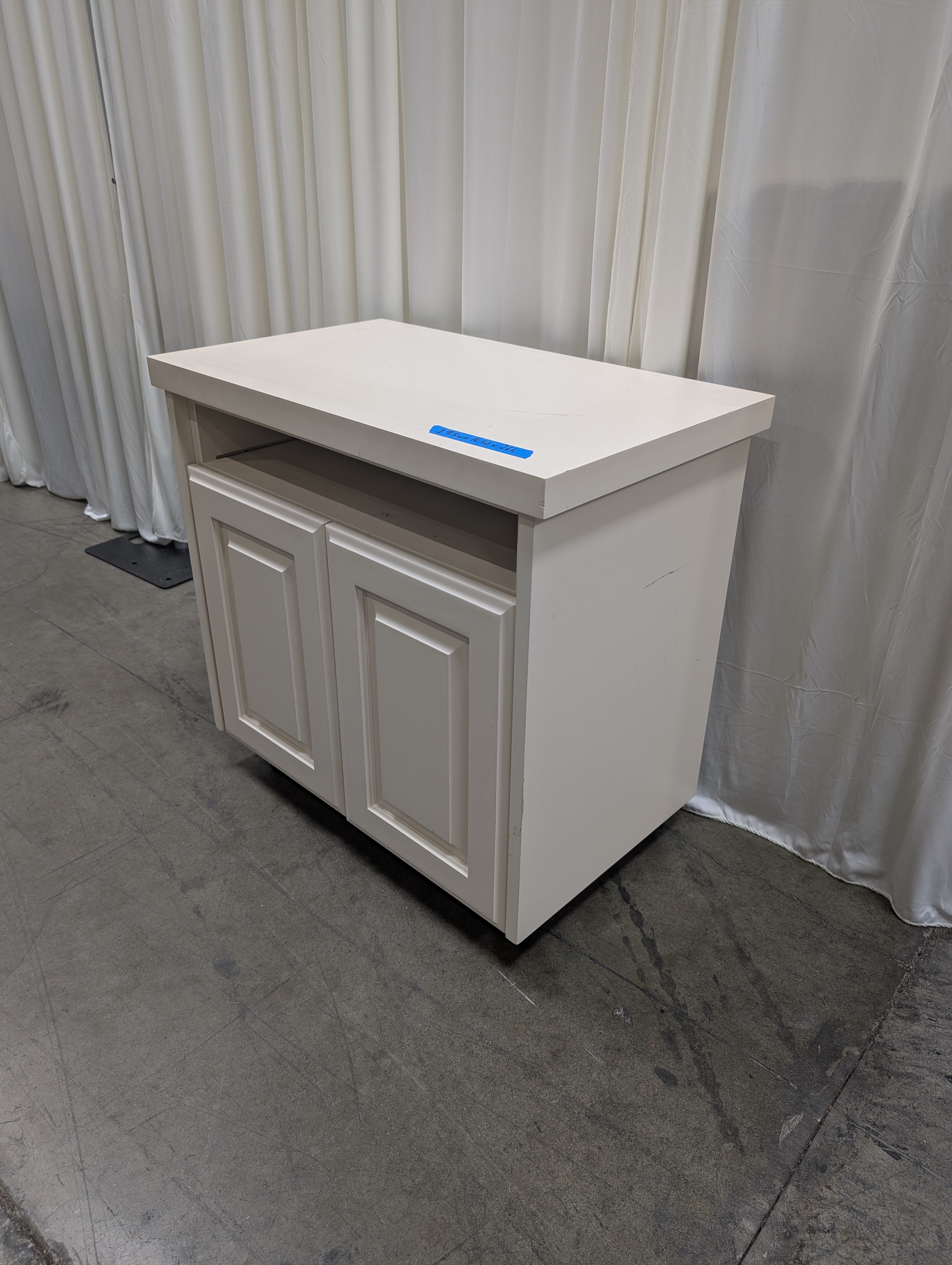 White Wood Two-Door TV Stand with Open Shelf