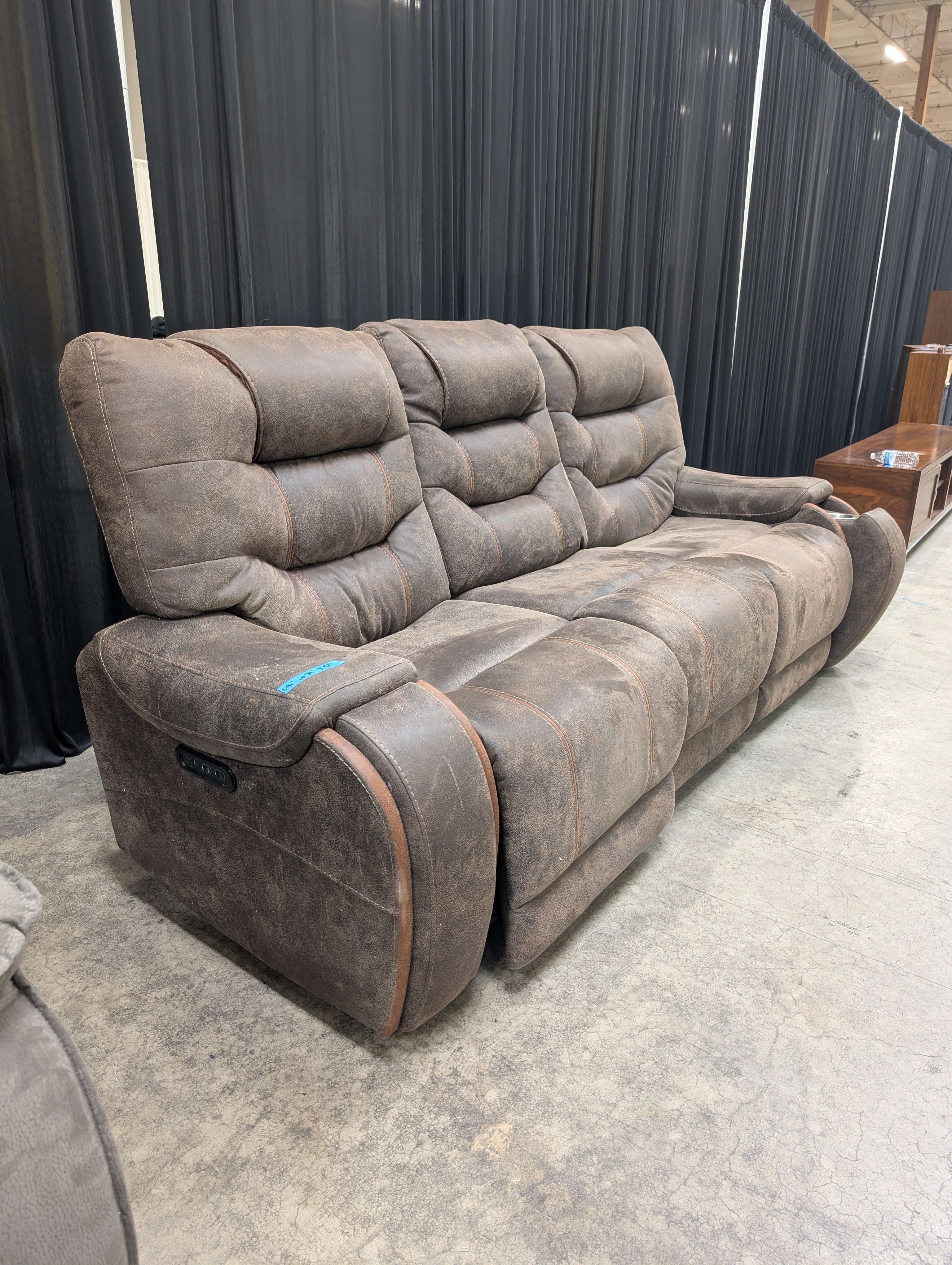 Distressed Brown Three-Seat Reclining Couch