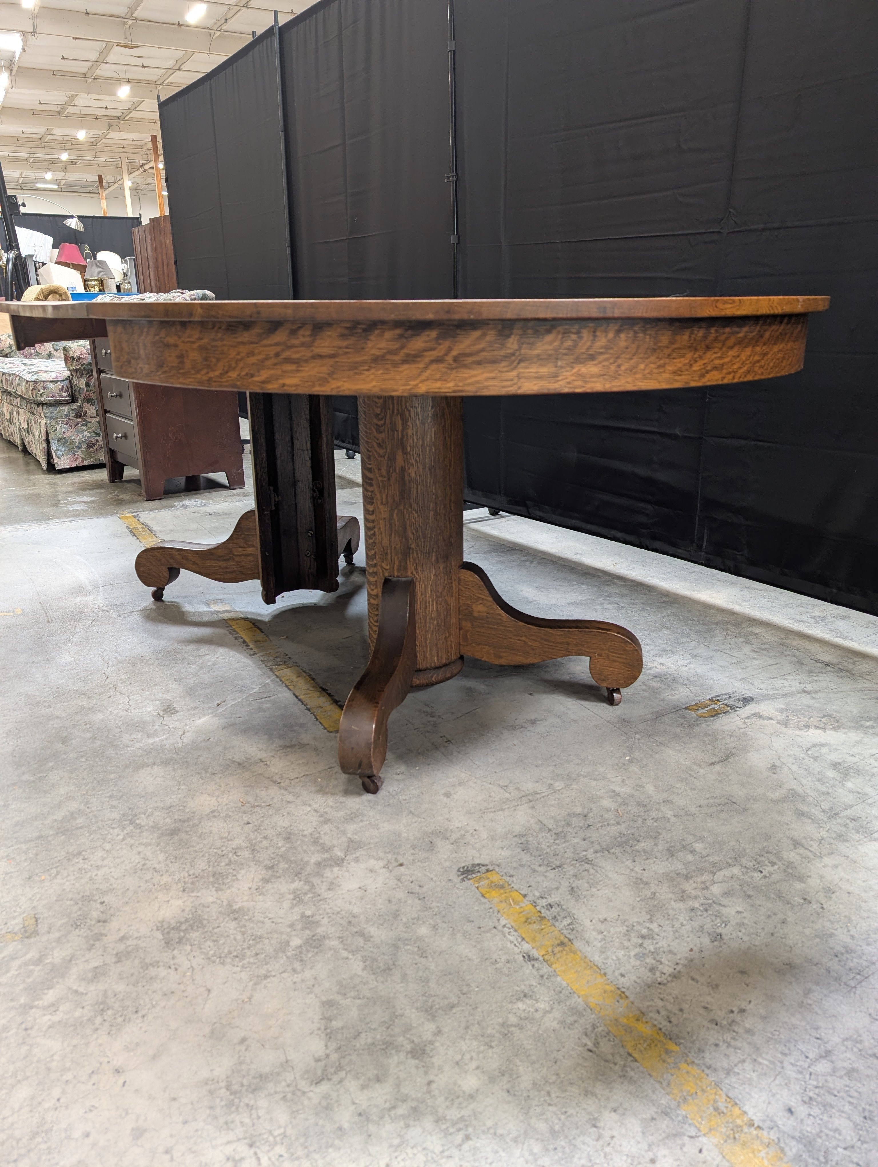 Round Dark Stained Wood Pedestal Dining Table