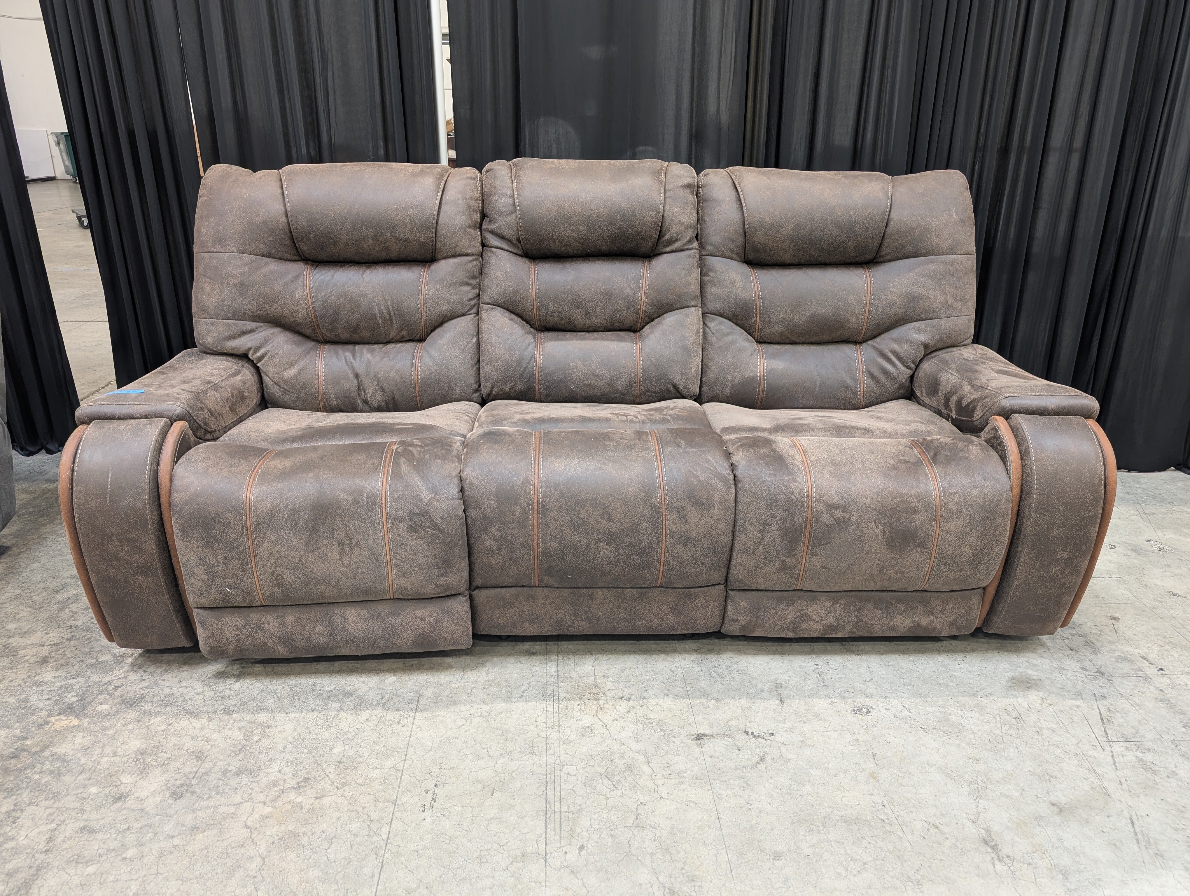 Distressed Brown Three-Seat Reclining Couch