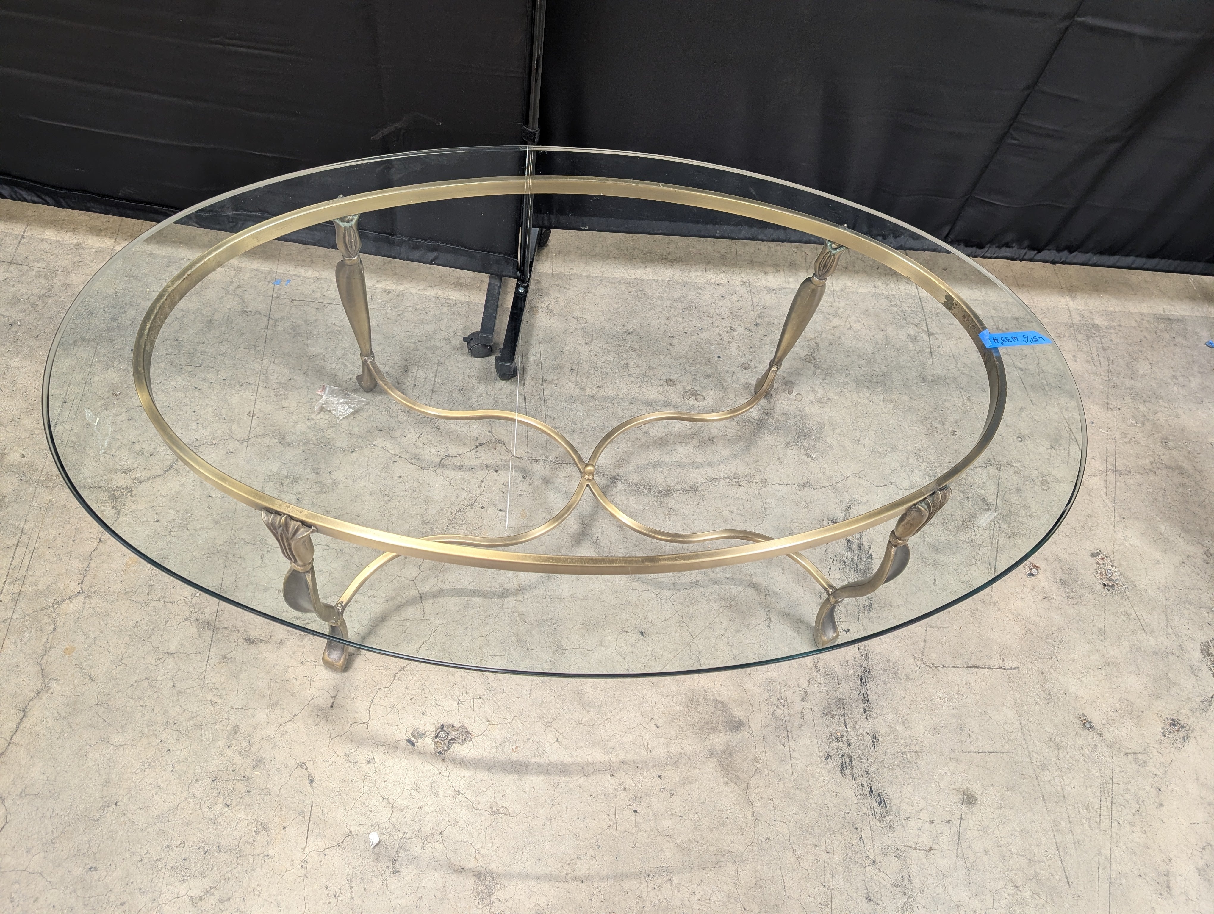 Ornate Brass-Toned Oval Coffee Table with Glass Top
