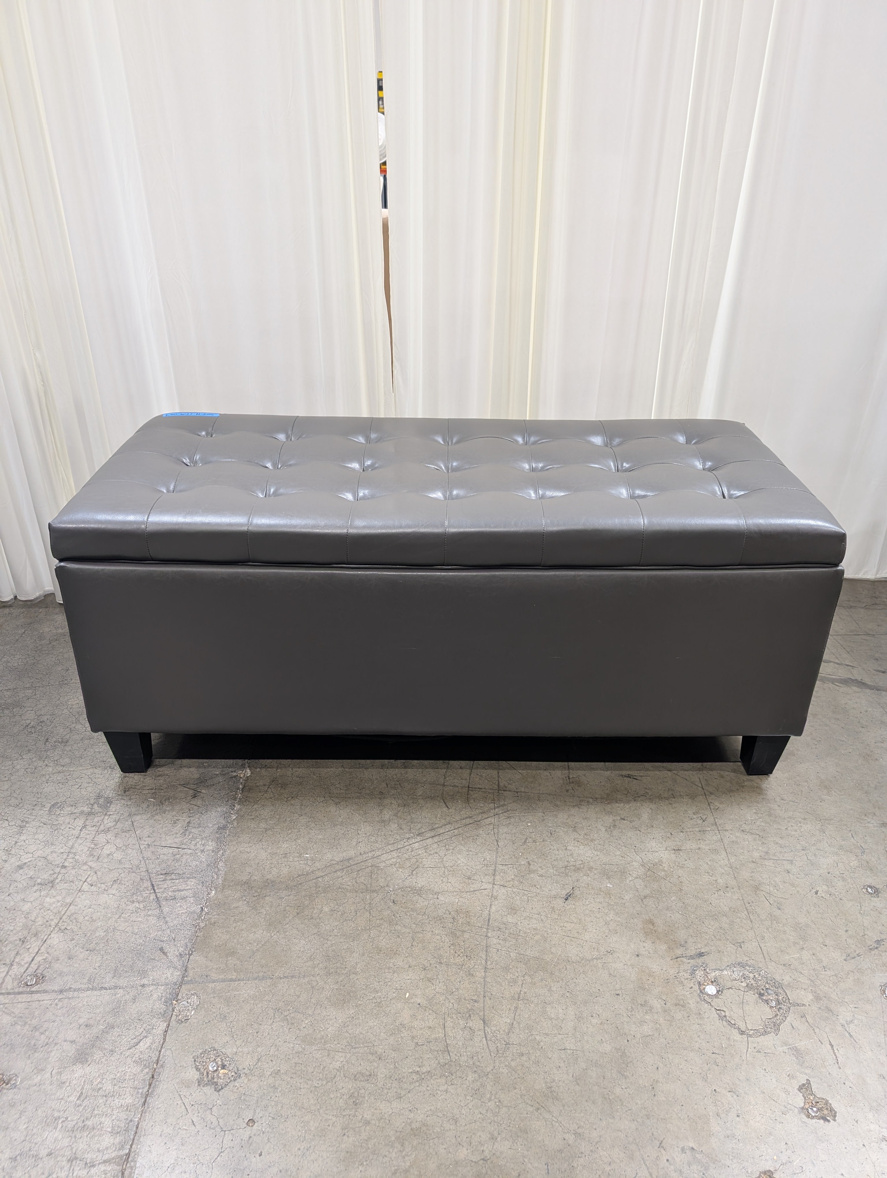 Charcoal Tufted Storage Ottoman in Faux Leather