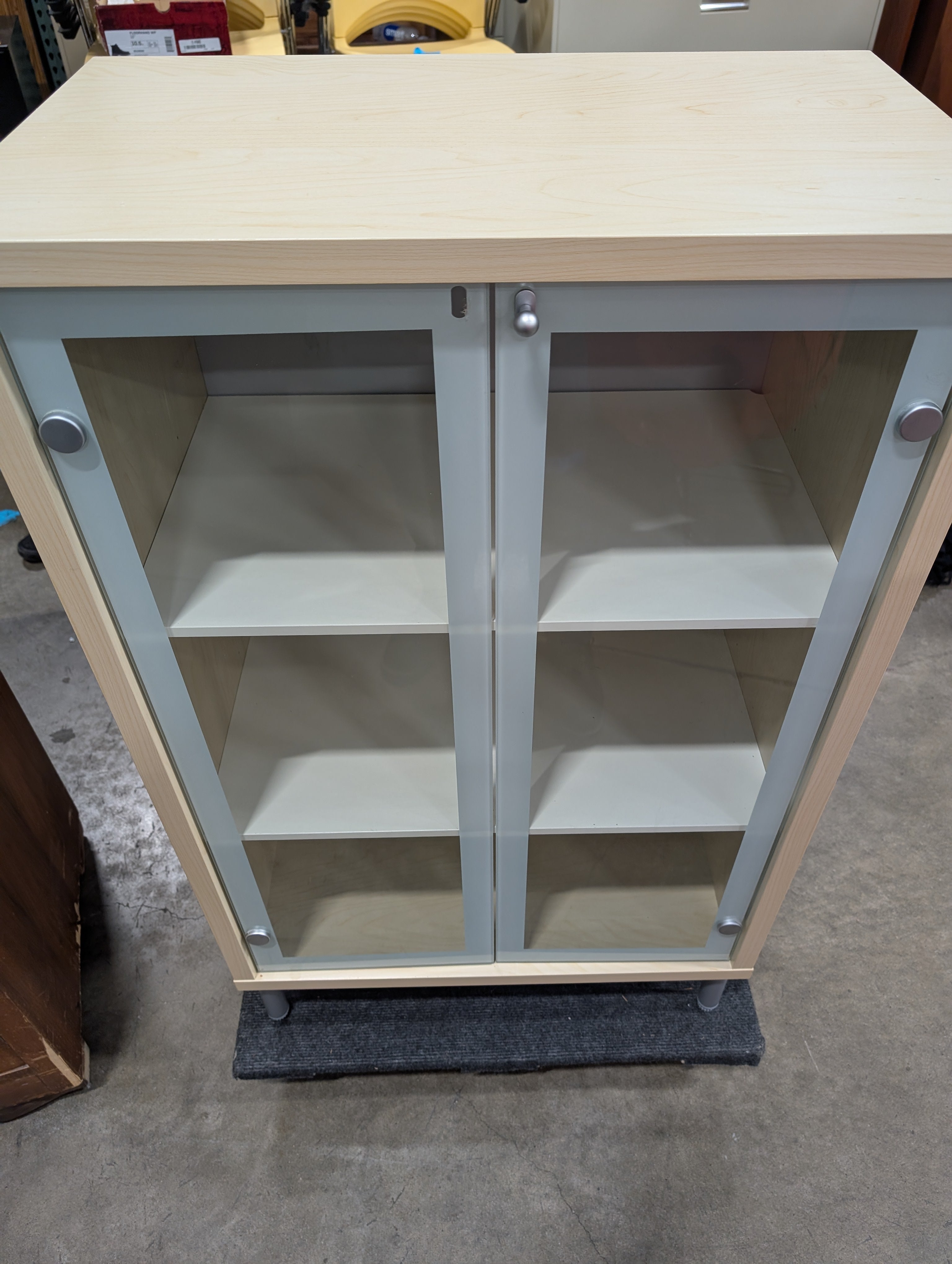 Light Wood Glass-Front Cabinet with Shelving