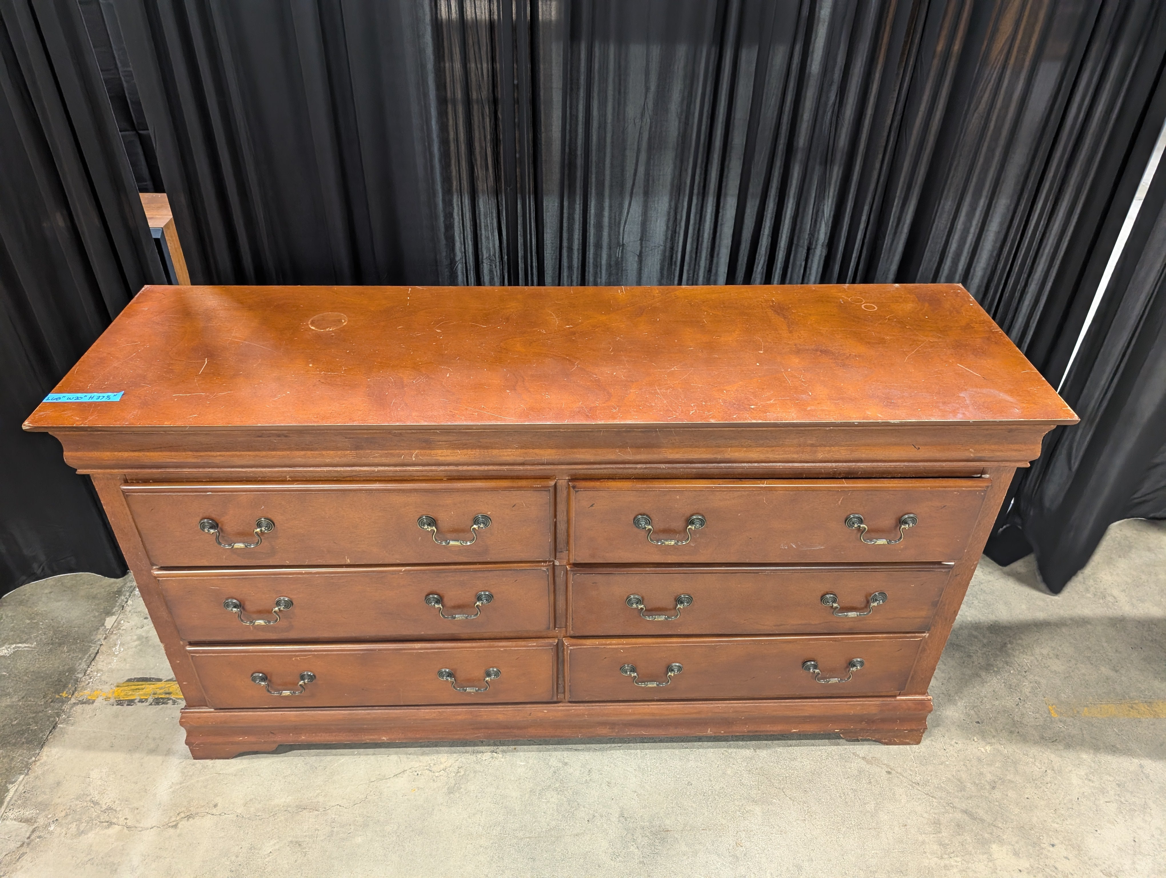 Dark Wood Six-Drawer Dresser with Ornate Hardware