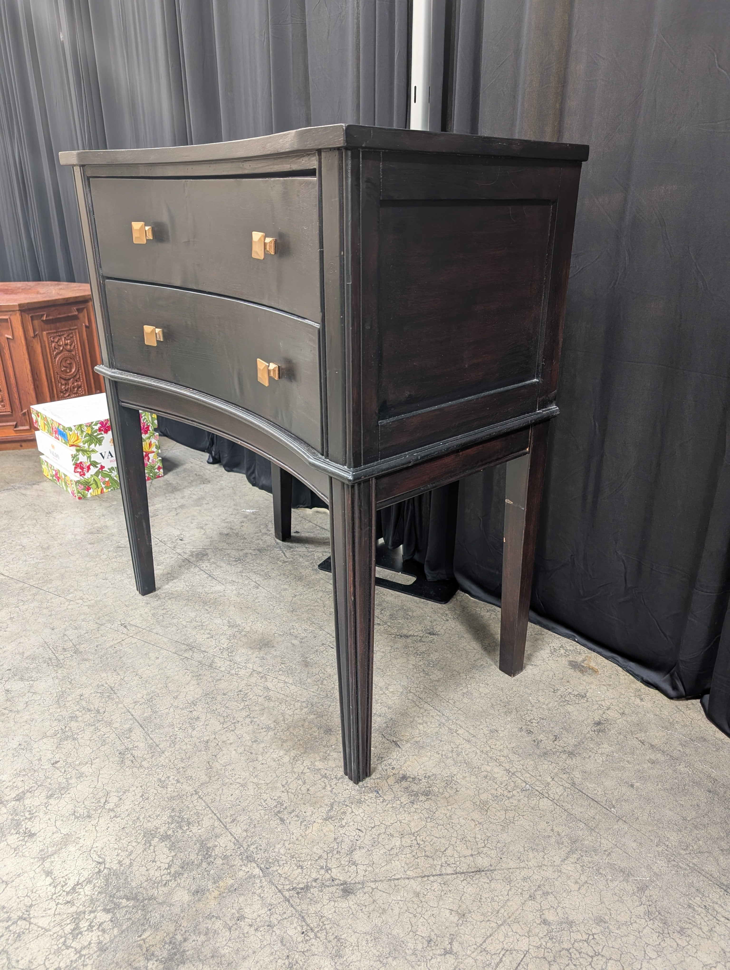 Black Curved Wood Nightstand with Gold Knobs