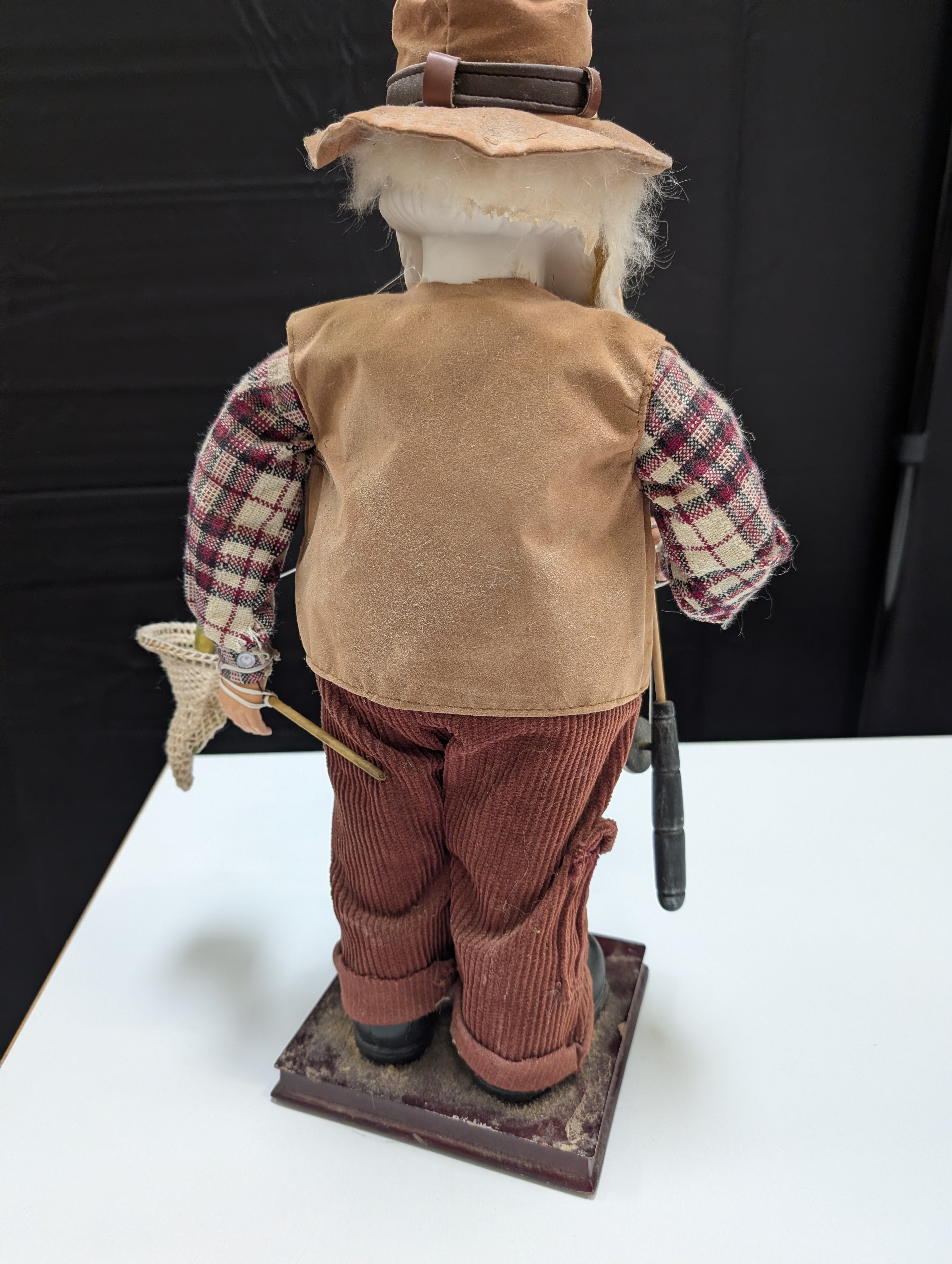 Rustic Fisherman Figurine with Fishing Rod and Hat