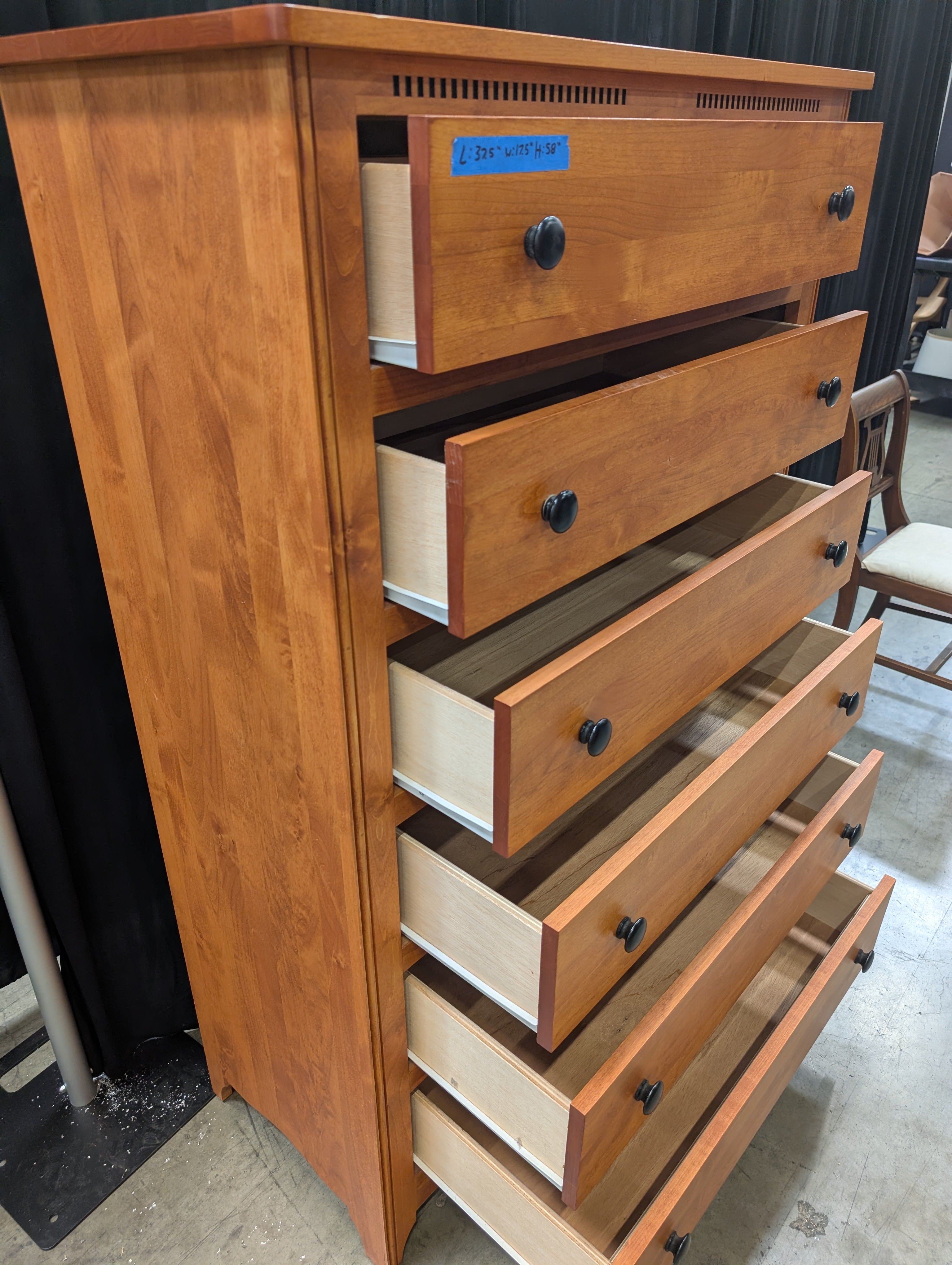 Warm Honey Wood Six-Drawer Dresser with Dark Knobs