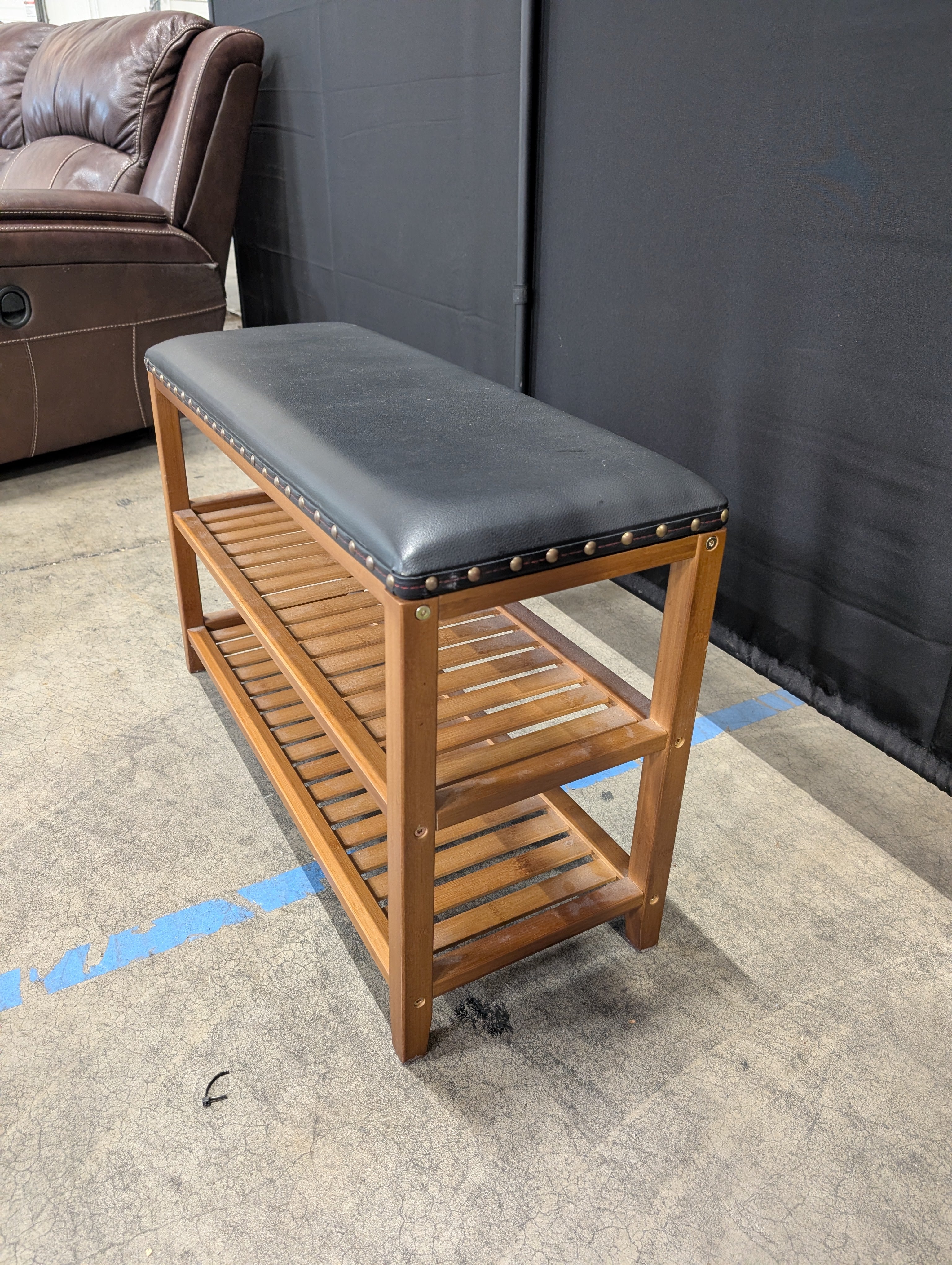 Hardwood Entryway Bench with Padded Black Upholstery and Slatted Shelves