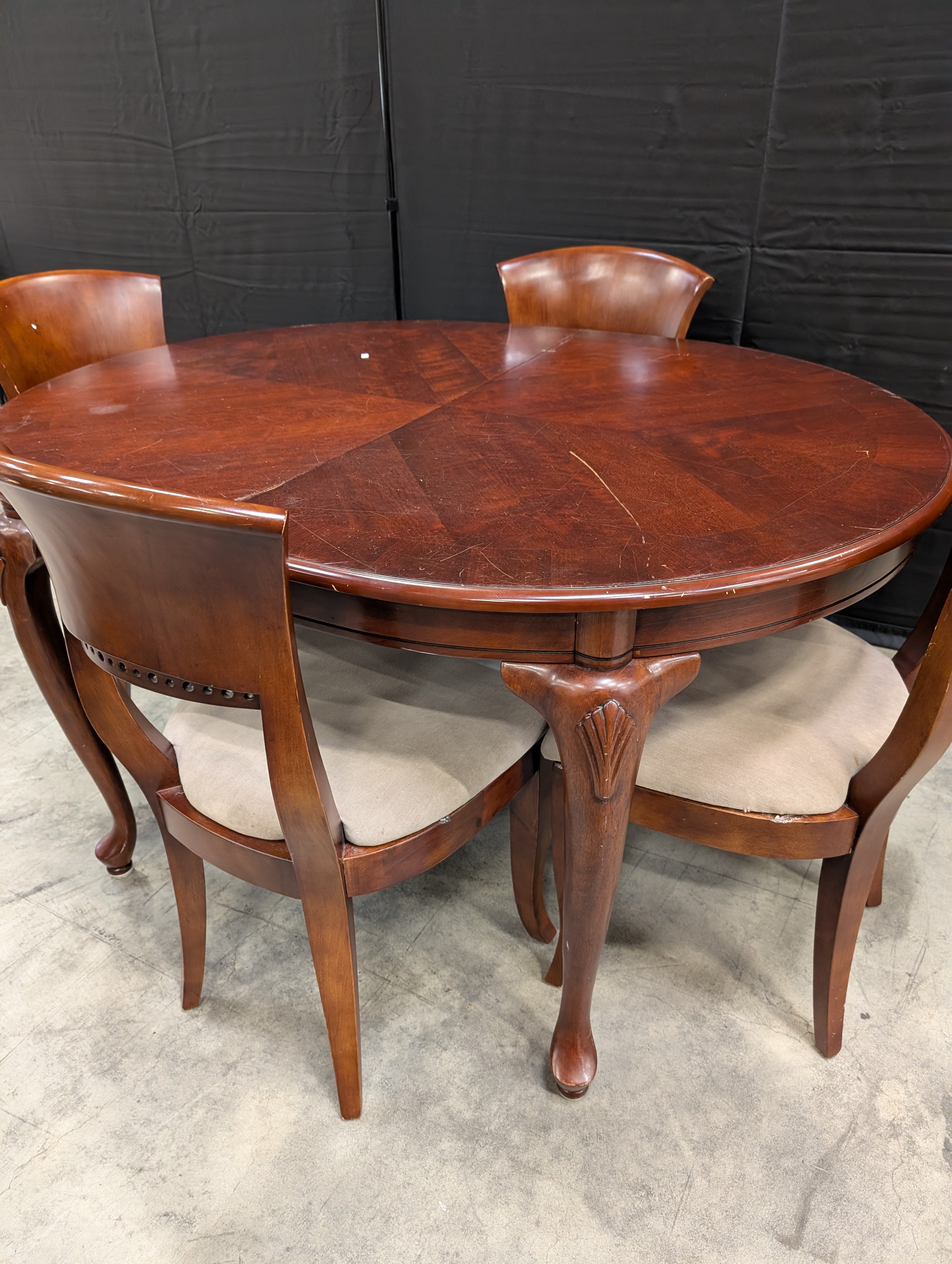 Traditional Dark Wood Oval Dining Table with Four Upholstered Chairs