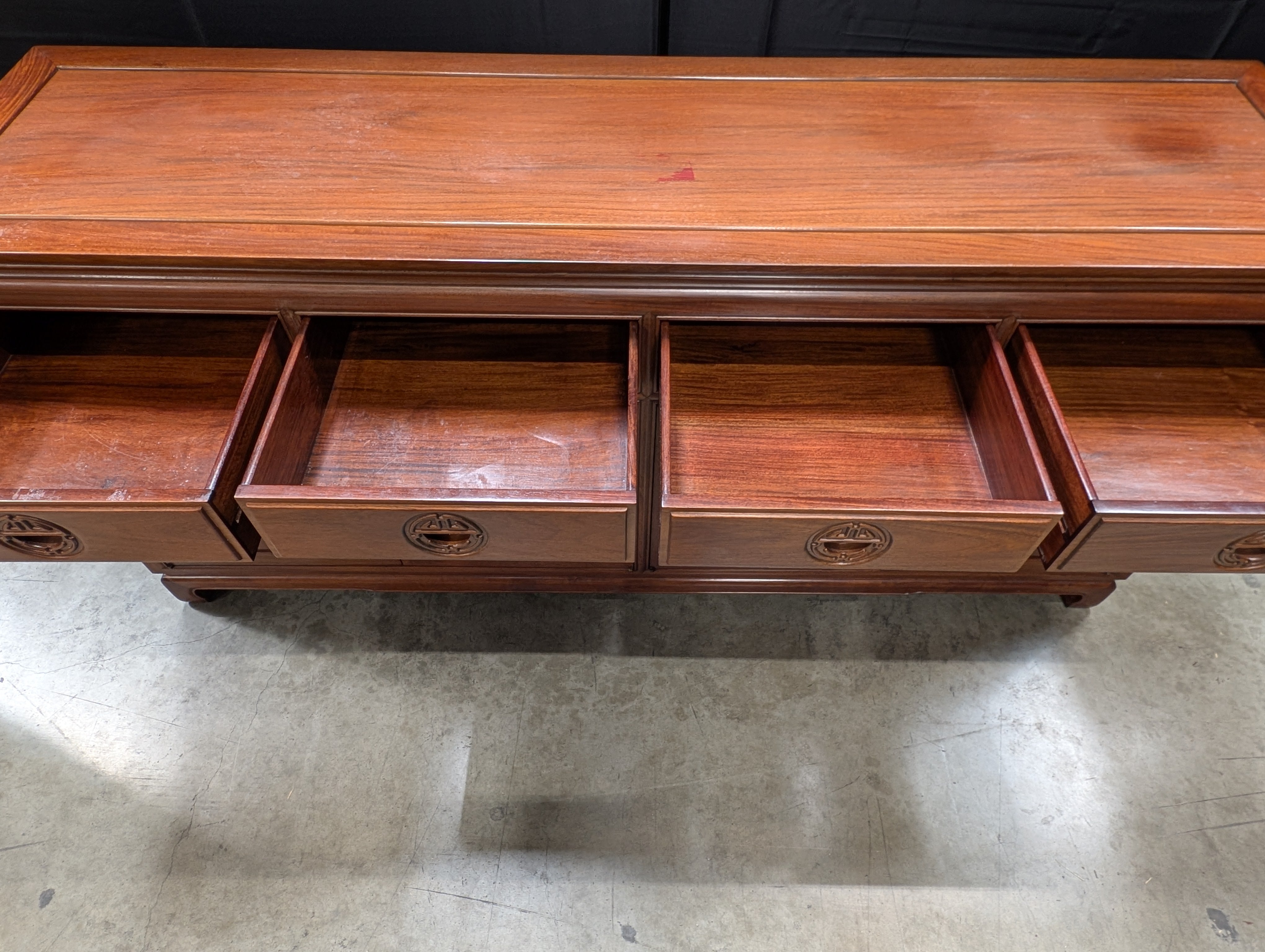 Rich Toned Wooden Sideboard with Carved Accents